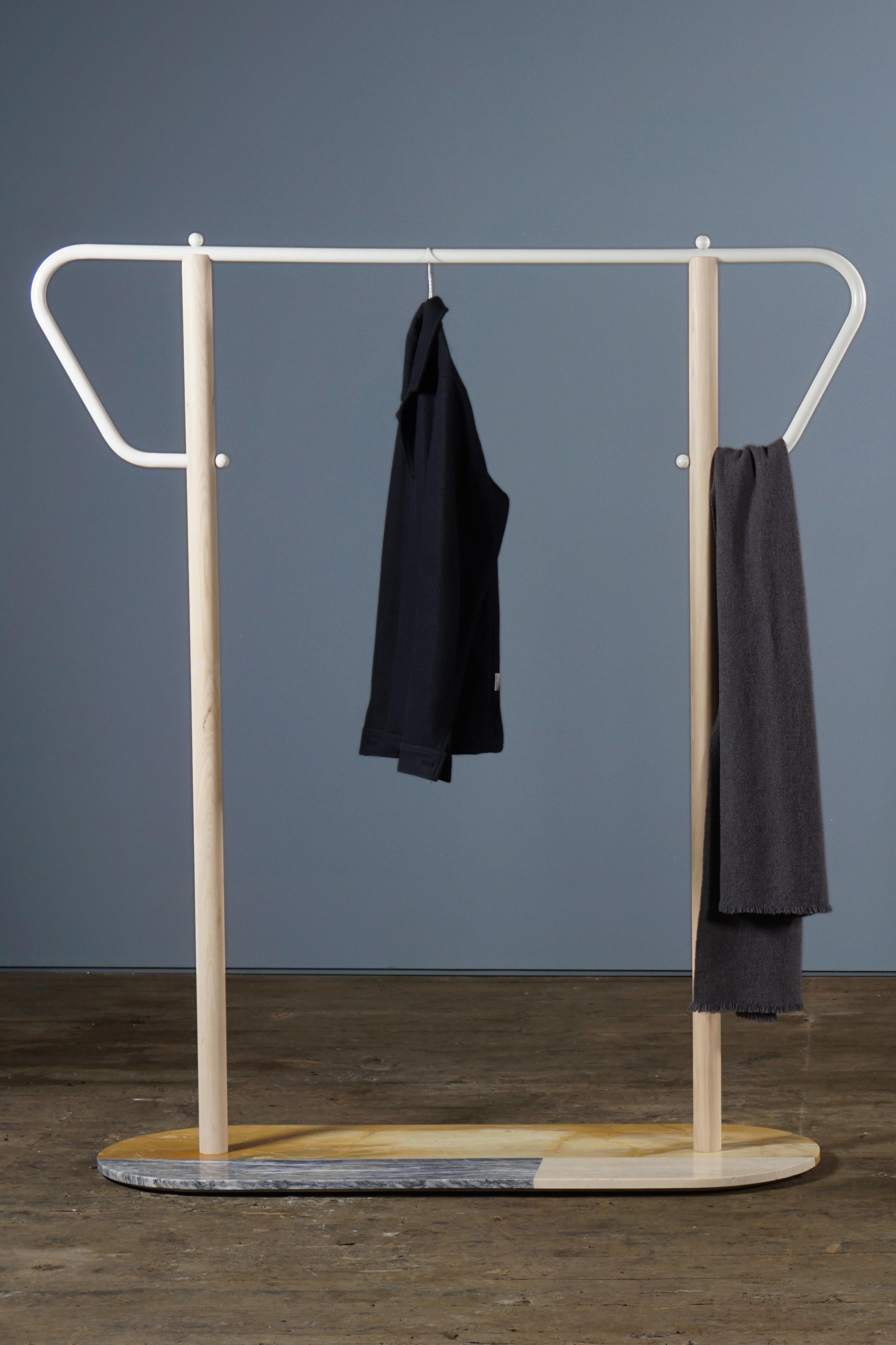 A marble base, wooden uprights and tubular steel form this simple but elegant garment rack.


Materials: 
Marble, ash and powder coated steel

Dimensions: 
40 cm x 150 cm x 160 cm 
16