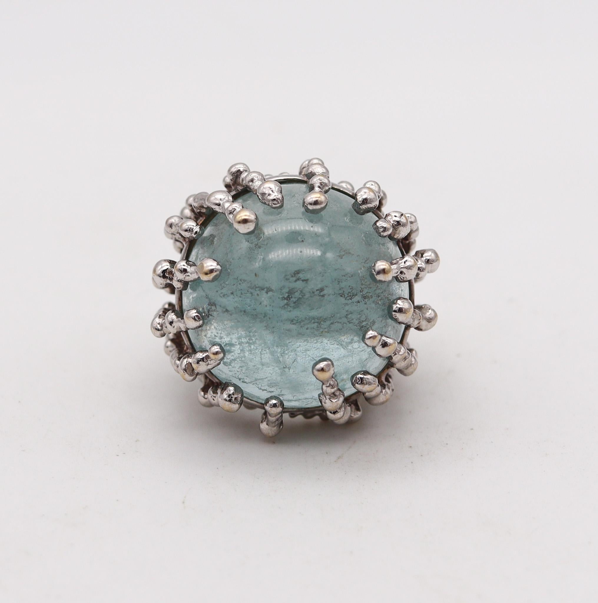 A sculptural ring designed by Garnazelle.

This is a fabulous sculptural ring, created in Paris France by the jewelry house of Garnazelle, back in the 2000. This ring is a one of a king piece, designed with multiples elements forming a kind of nest