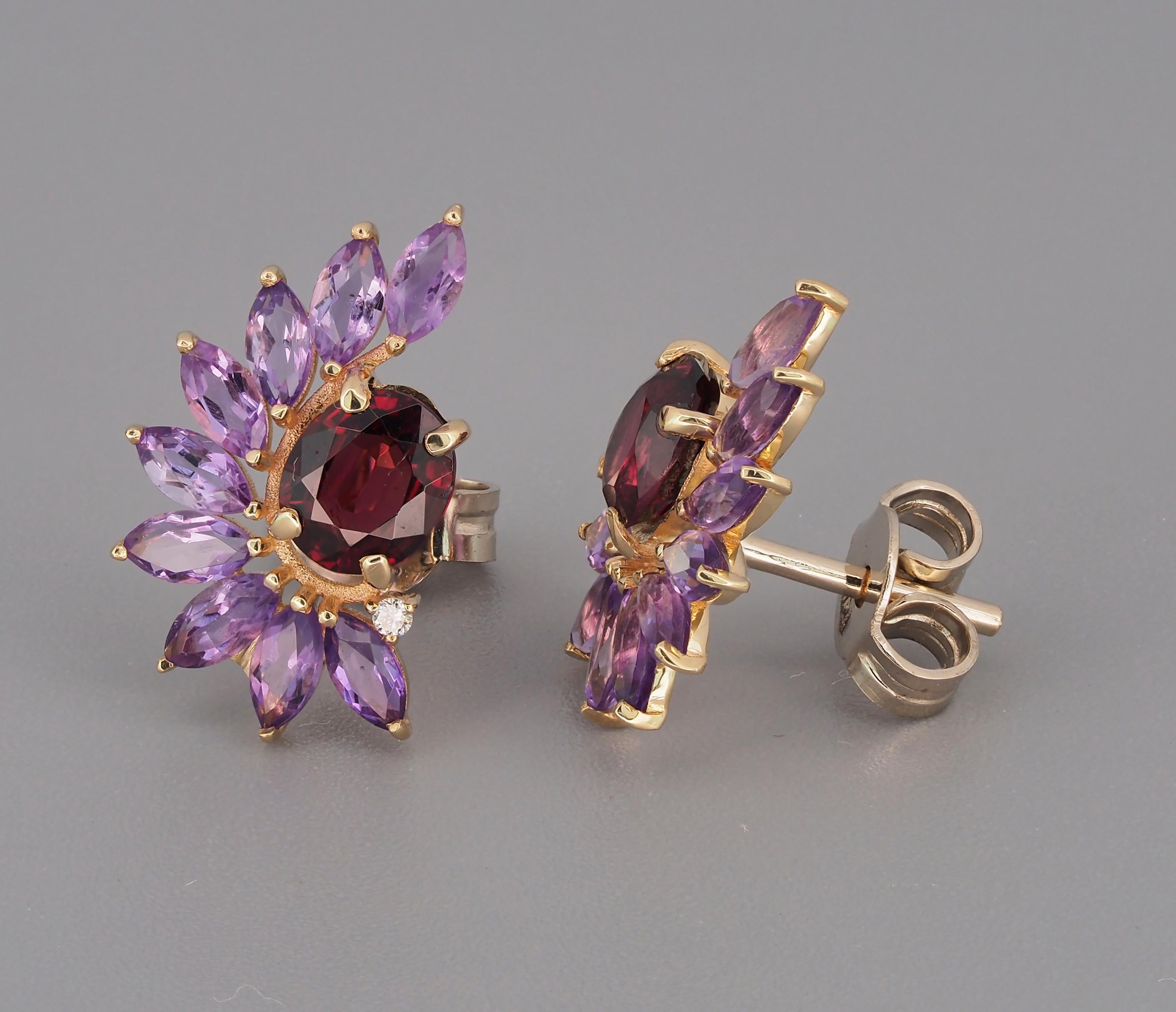 Garnet 14k gold earrings studs. Amethyst earrings studs in 14k gold. Garnet and amethyst in 14k gold earrings studs. Red, purple gemstones earrings.

Material: 14k gold.
Weight: 2.3 gr.
Size Earrings: 10x16.6mm
Central stones: Natural Garnets - 2