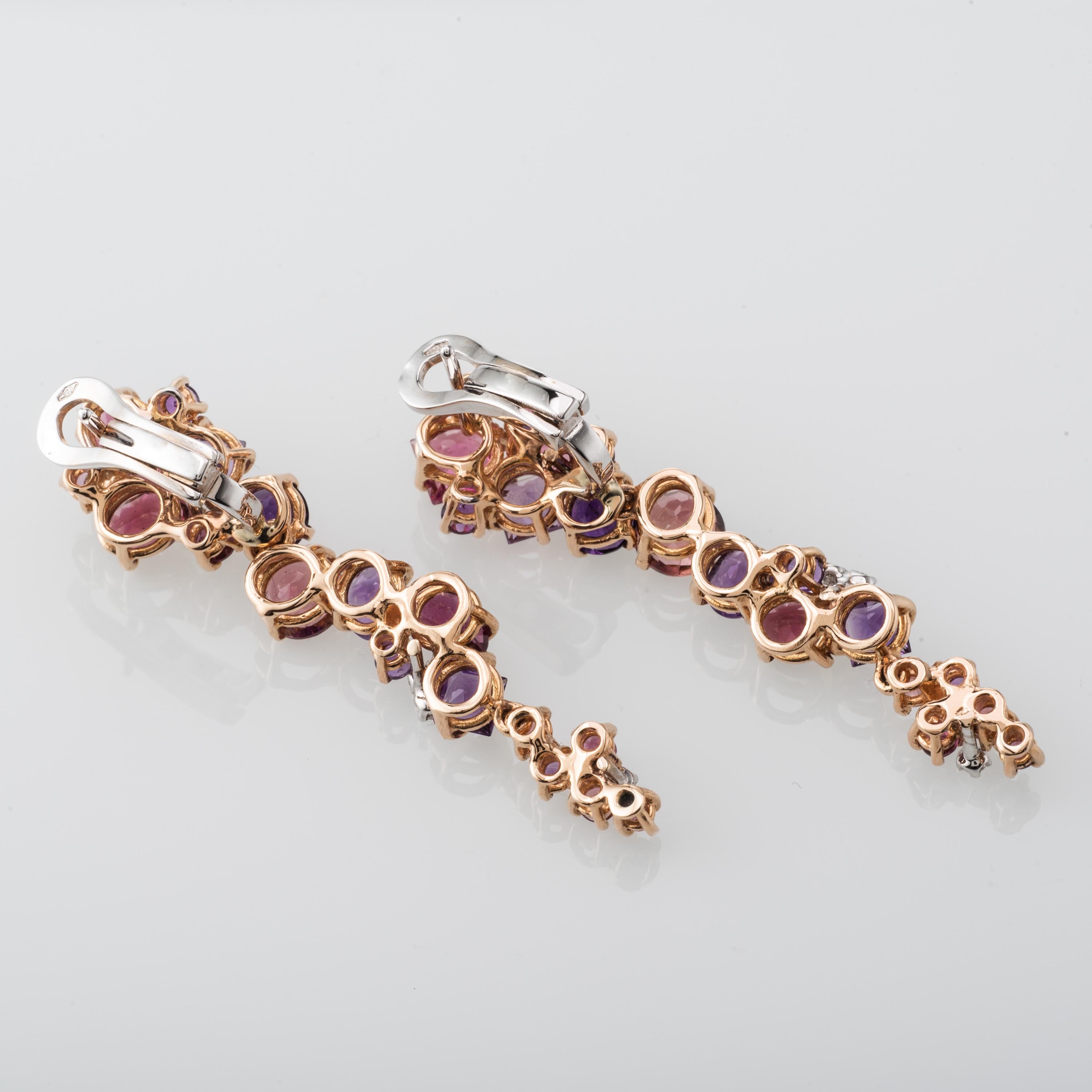 This 18 Karat Rose and White Gold Earrings features Amethysts, Garnets and Diamonds. Produced in Italy, with attention to a very small detail.
Beautifully set with 10.5 Carat of Gemstones, 0.28 Carat of Diamonds.