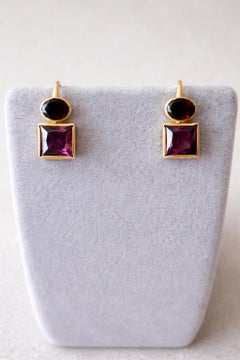 Silberne Ohrringe mit Granat und Amethyst