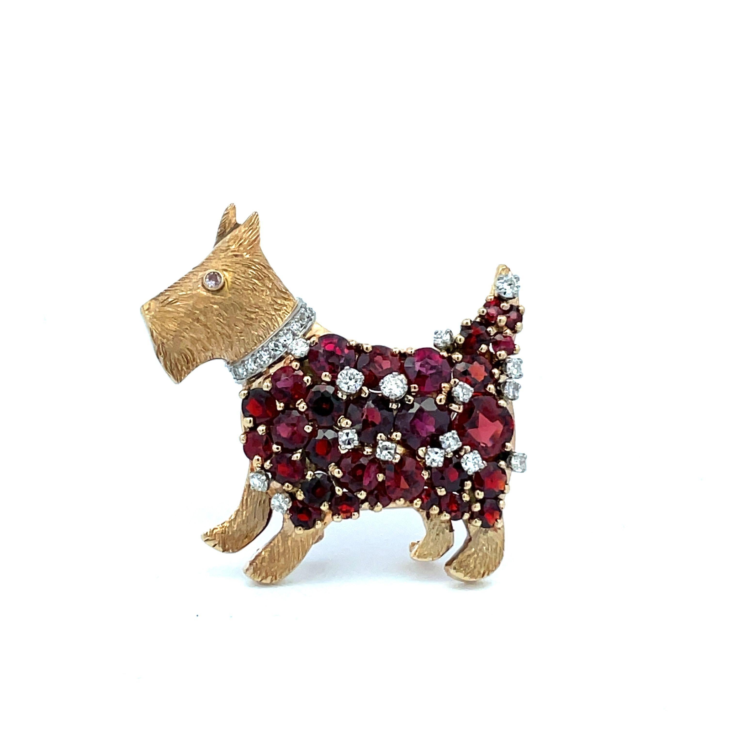 Our terrier is naturally adorable with his diamond collar and eye, and festive in a garnet and diamond coat. The little fellow measures 1-1/2″ x 1-1/2″ with double pin stem clasp and extra jump ring to wear on a chain if desired. In 14K gold, circa