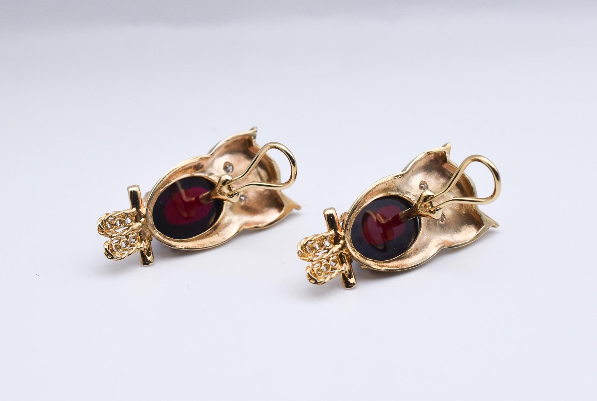 An exquisite pair of Owl Earrings showcasing a Cabochon Garnet Tummy and Diamond Eyes and Feet. Made in America, circa 1950.