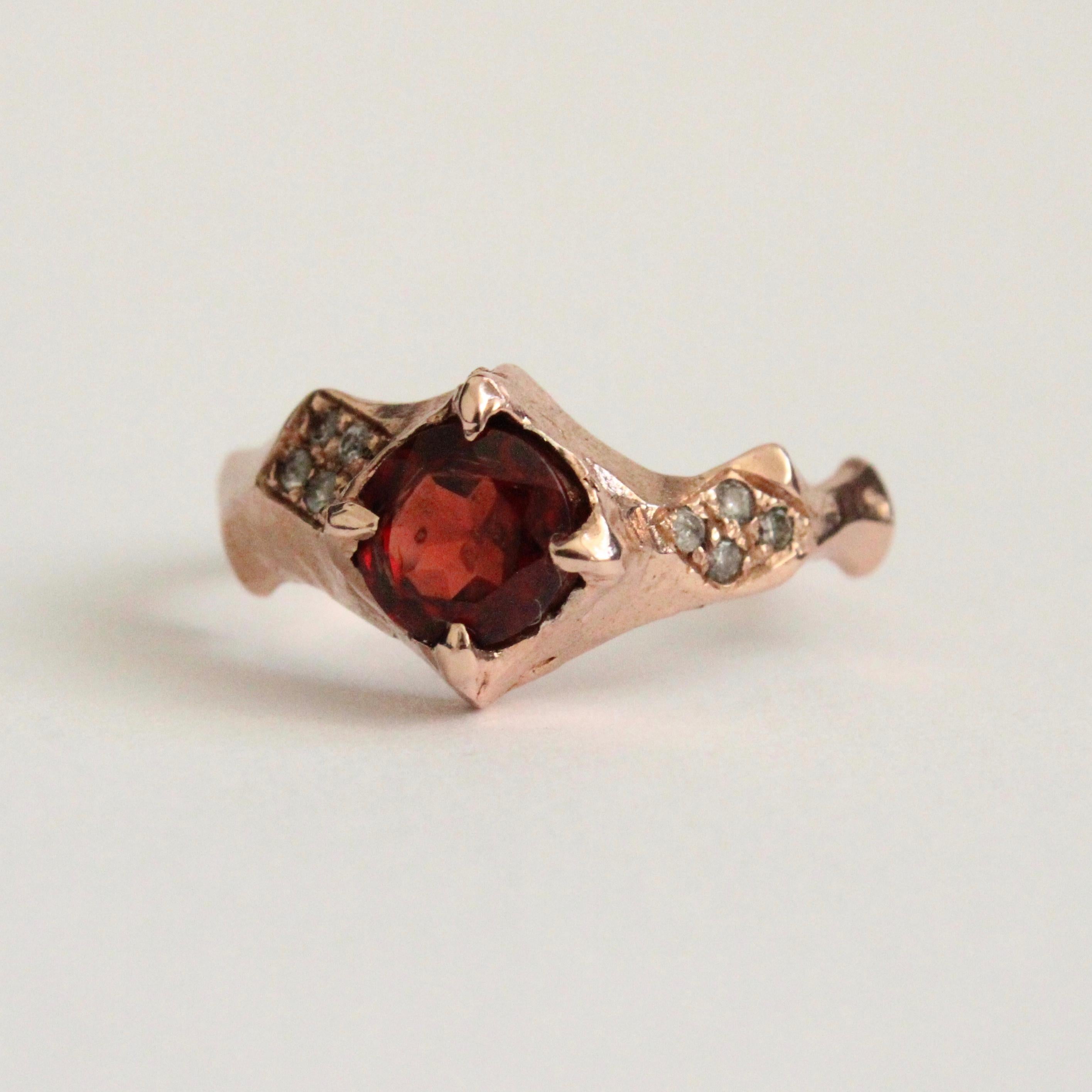 This handmade rose gold ring is hand carved and set with 1.3mm pave diamonds and a center 6mm deep red garnet . One of a kind Size 6.5
