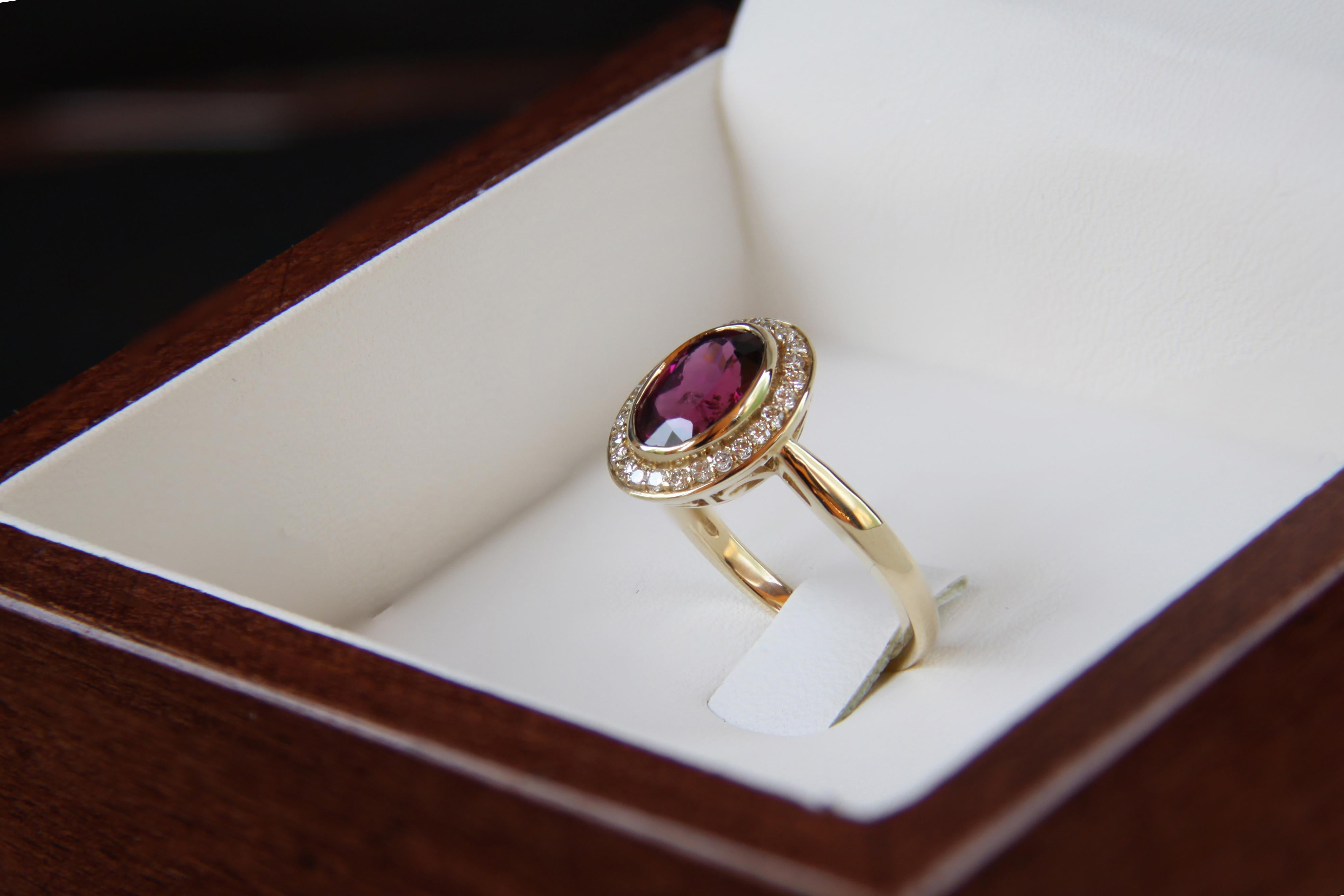 Modern Garnet and diamonds 14k gold ring.  For Sale