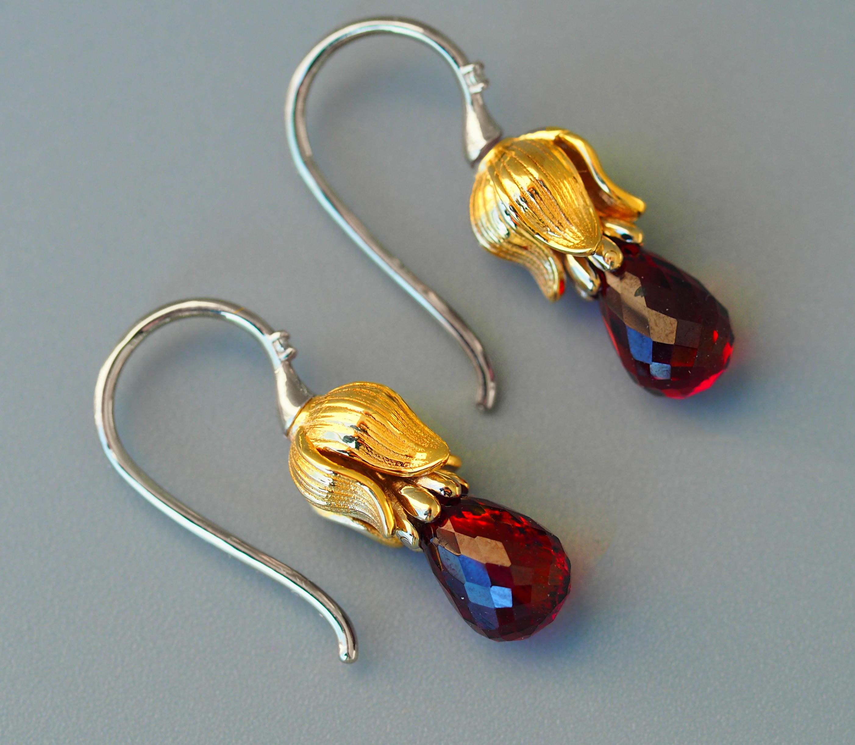 Garnet and diamonds earrings. 
Briolette garnet earrings. Lily flower earrings. Gold drop earrings. Statement earrings. Plant earrings.

Gold color yellow and white - 14k marked
Weight: - 3.25 g.
Size: 21x6mm. 
 
Garnets 2 pieces - red color,