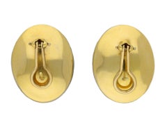 Garnet and enamel earrings, circa 1950.