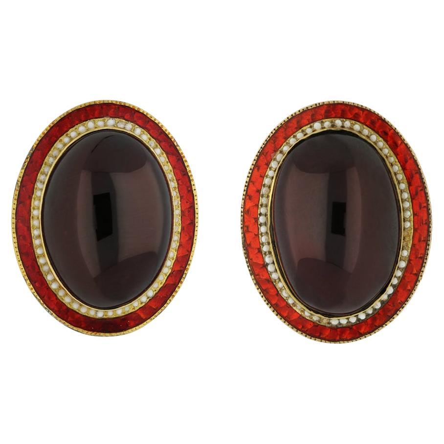 Garnet and enamel earrings, circa 1950. 