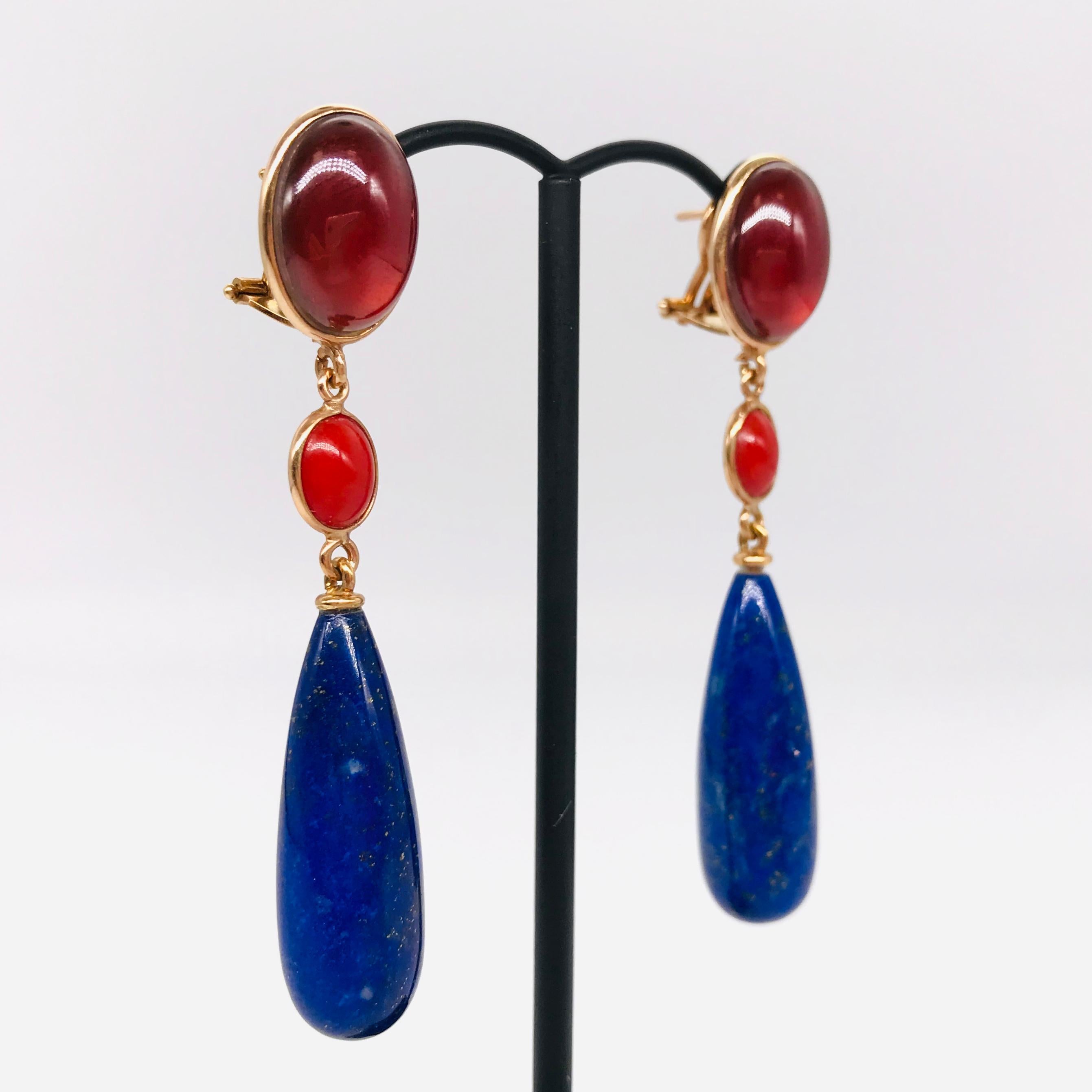 Discovers This Garnet and Lapis Lazuli On Pink Gold 18 k Chandelier Earrings 

Make a bold statement with these exquisite chandelier earrings, crafted from 18k pink gold and weighing 5 grams. Each earring features two natural garnets, two natural