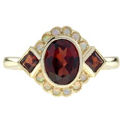 Anello in stile Art Deco con granato e opale in oro giallo 14K