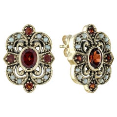 Orecchini con granato e perla in stile floreale vintage in oro giallo 9K