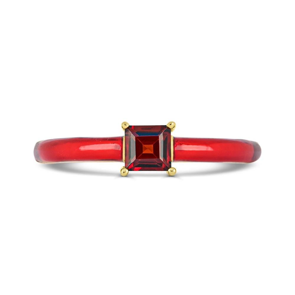 This elegant ring features one square-cut garnet prong sets between red enamel shank on top of a slim band ring in 14K yellow gold over sterling silver. 

Metal: 14K Yellow Gold over Sterling Silver
Gemstone:
Garnet: Square-Cut - 4X4mm.

This ring
