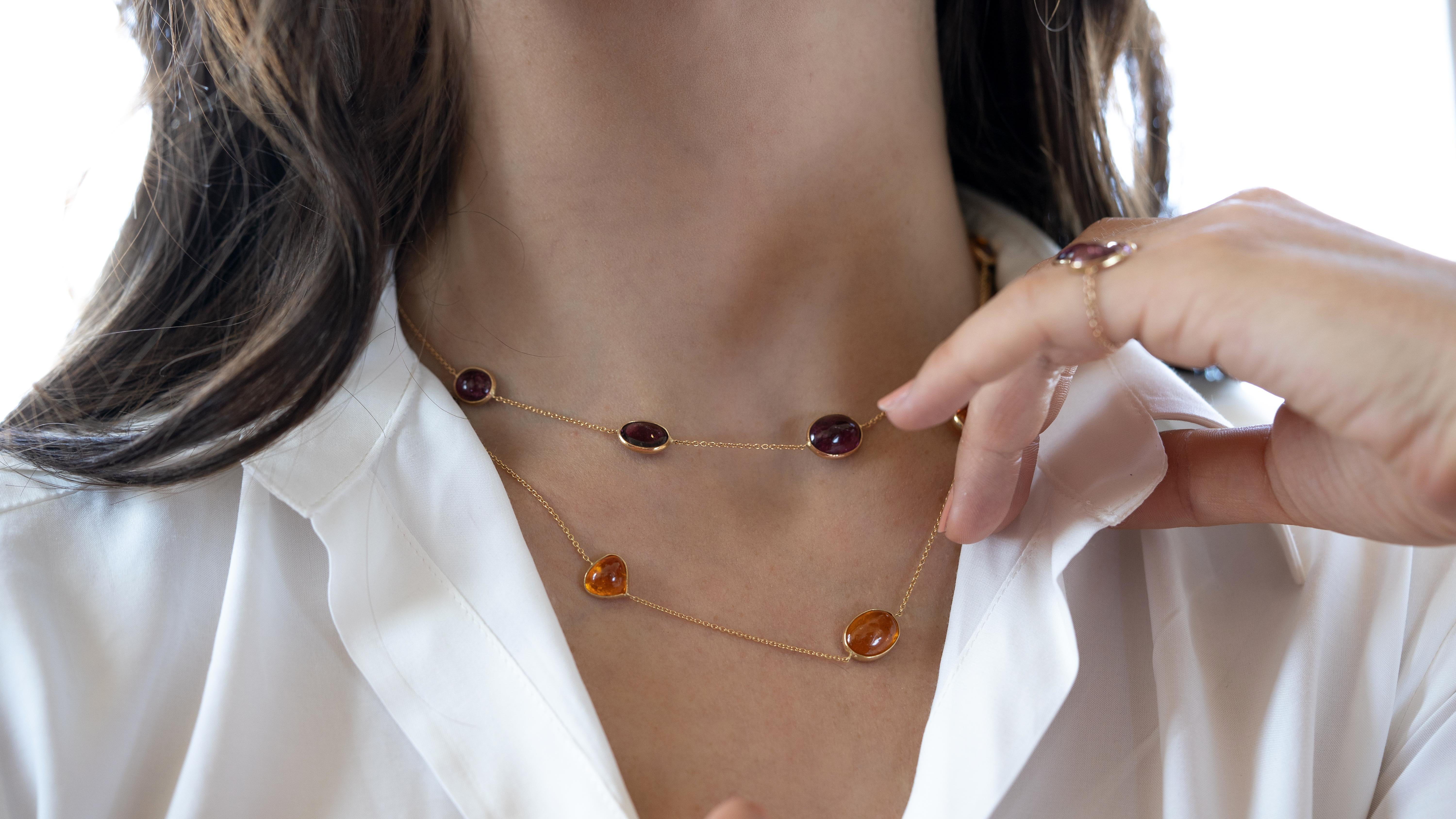 A beautiful harmony of colours for these two charming necklaces. One is made of seven hessonite garnet cabochons set on 18K yellow gold chain. The second one is made of eight pink tourmaline cabochons set on 18K pink gold chain.
Hessonite garnet