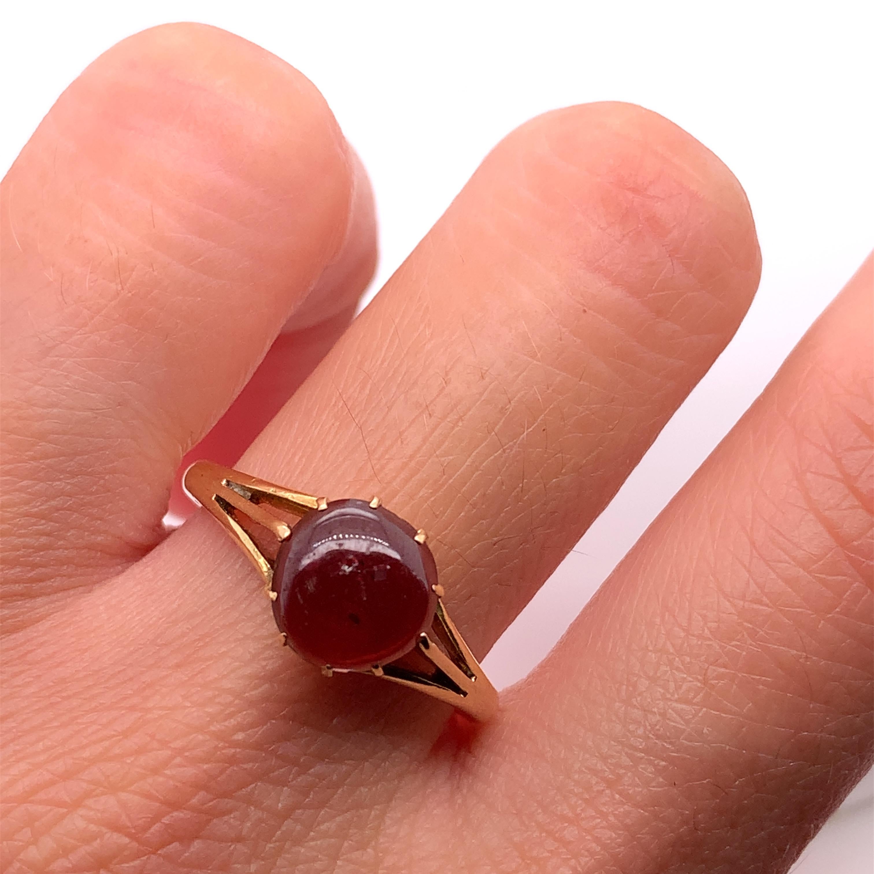 
1.00ct garnet natural untreated In 18k Yellow Gold engagement ring.

Antique style solitaire engagement ring.

Natural garnet cabochon shaped gemstone solitaire engagement ring in 18ct yellow gold:

Hallmarked

Size N 1/2.

The ring can be