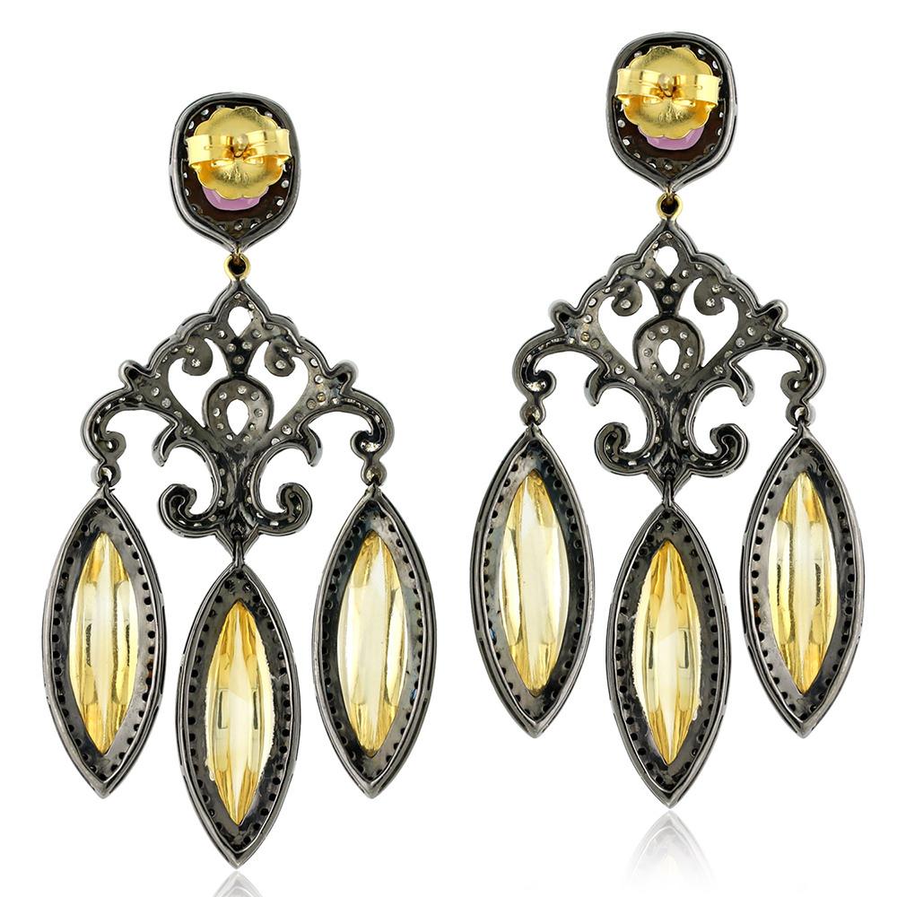 Stunning this Rhodolite Citrine Chandelier Earring with Diamonds is like that cocktail earring you have been looking for in silver and gold.
Closure: Push Post

18k:3.16g
Diamond: 4.9ct
Silver: 21.46gm
Rhodolite: 5.90ct
Citrine: 42.60ct
