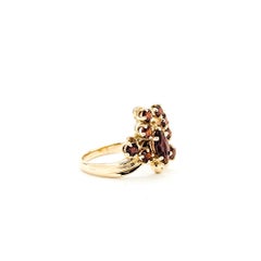 Bague en or jaune 14k avec grappe de grenats