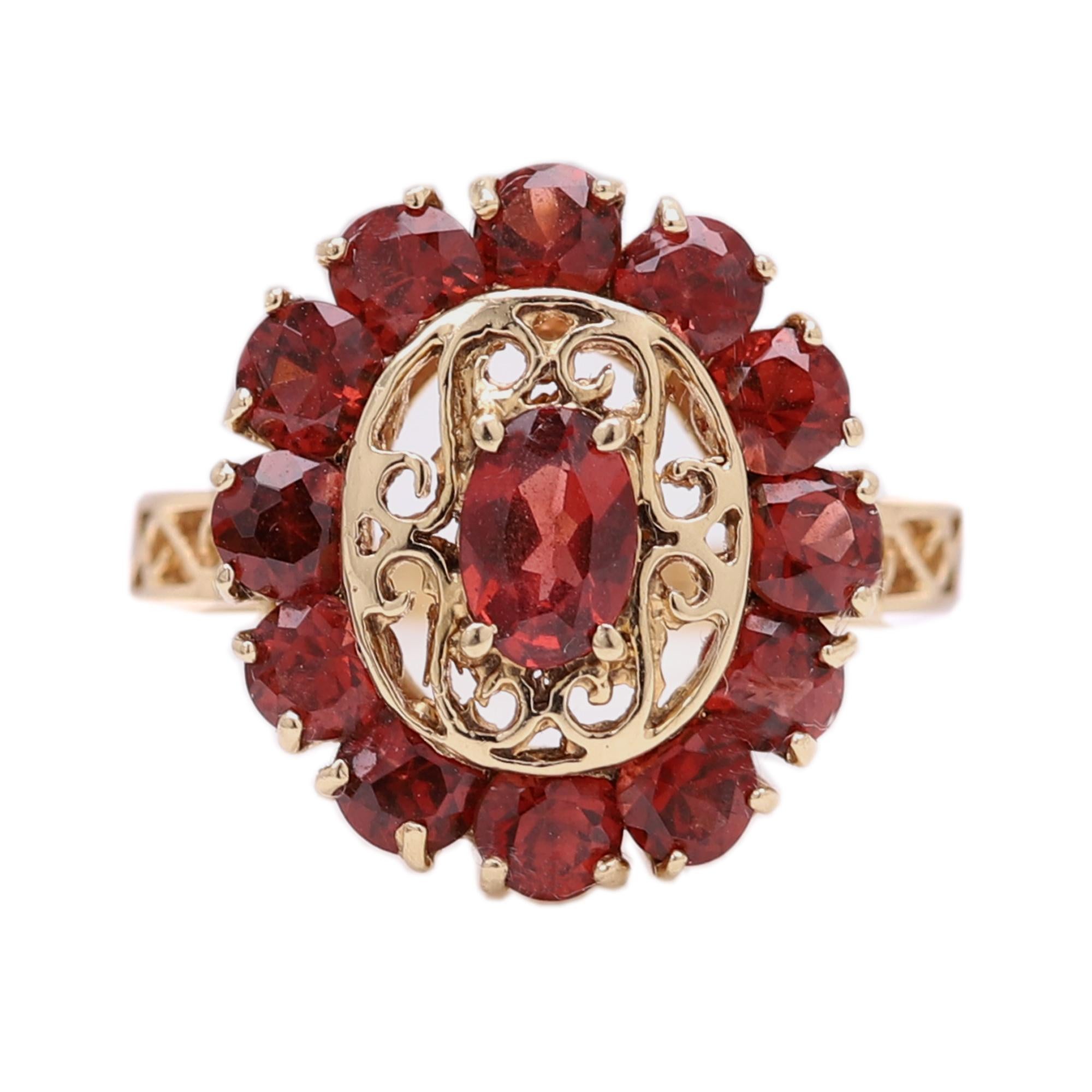 Vintage Cocktail Garnet Ring
Vibrant Brilliant colors of Natural Garnet.
The garnet gemstone tone is Orange-Red
overall size of the top area is 22 x 20 mm
Center Oval Garnet size is approx 7x5 mm
14k yellow gold  3.80 grams
Finger size 7
circa