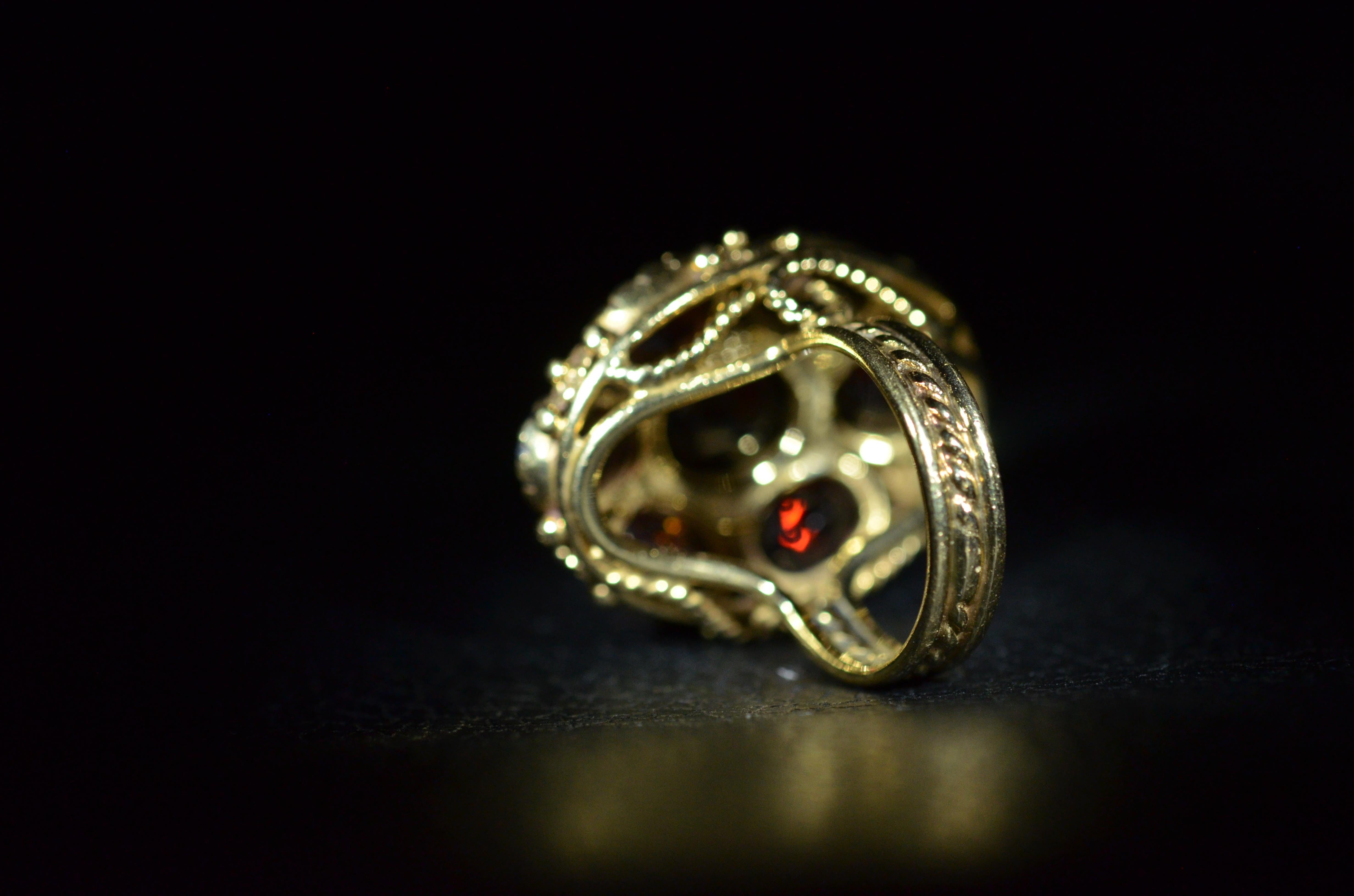 Oval Cut Garnet Cocktail Ring in 14 Karat Yellow Gold For Sale