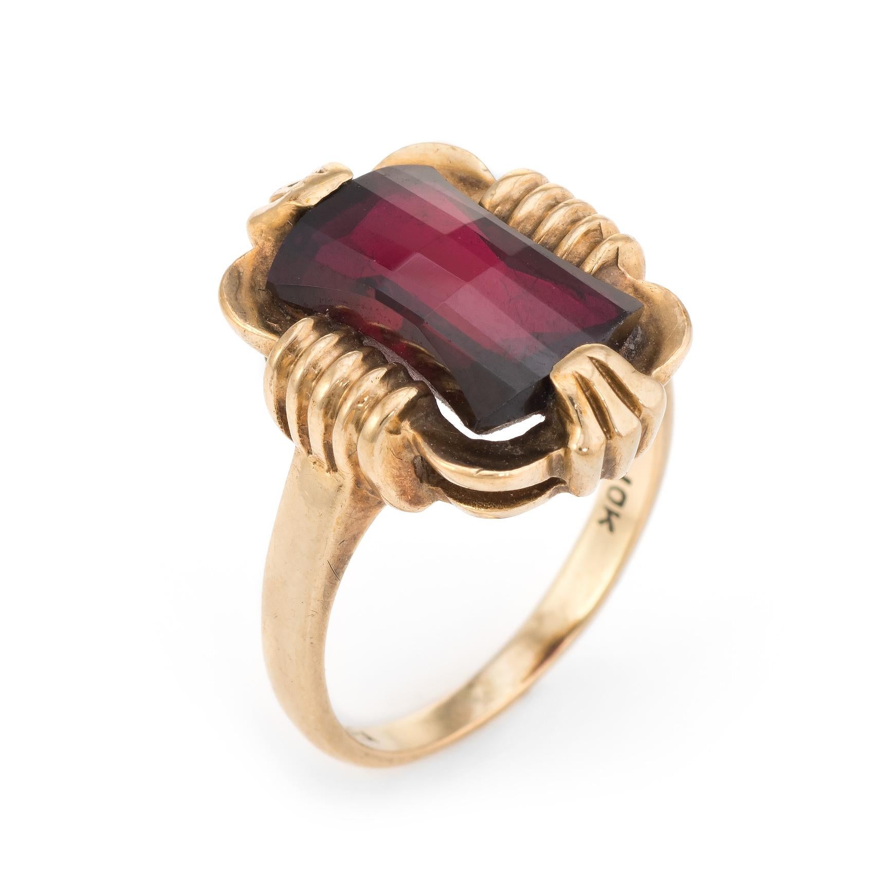 Elegant vintage cocktail ring, crafted in 10 karat yellow gold. Pre Owned 5

Faceted garnet measures 11mm x 6.5mm (estimated at 3 carats). The garnet is in excellent condition and free of cracks or chips.   

The ring is in excellent condition.