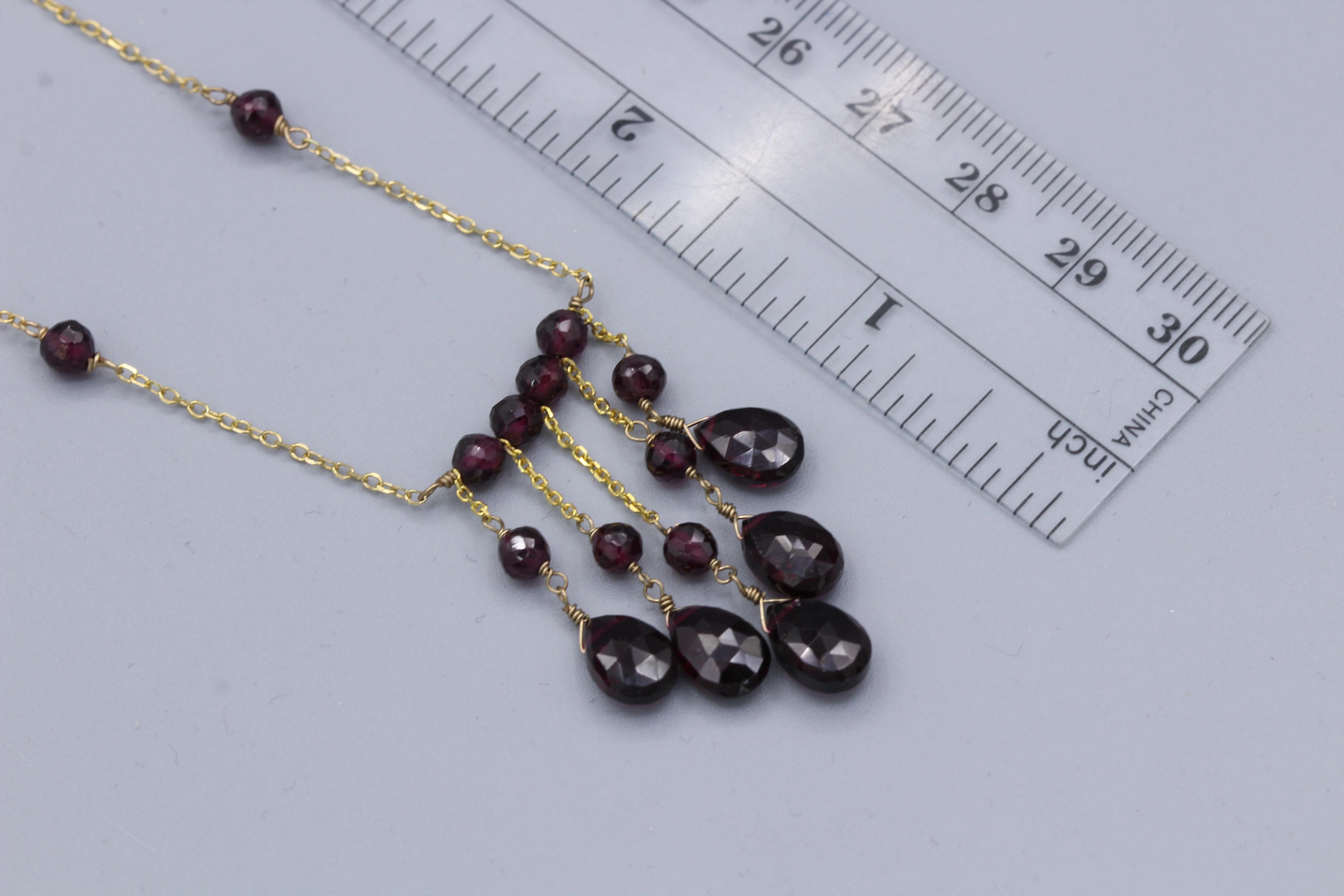 Elegant Dangling Garnet Bead Necklace Wire Style
14k Yellow Gold 
Length 16’ Inch
Dangle length approx. 1.25’ Inch
Natural Garnet Stones approx. 10 x 6mm and  4.0 mm beads
Spring Ring Lock
Total Weight 6.0 grams
