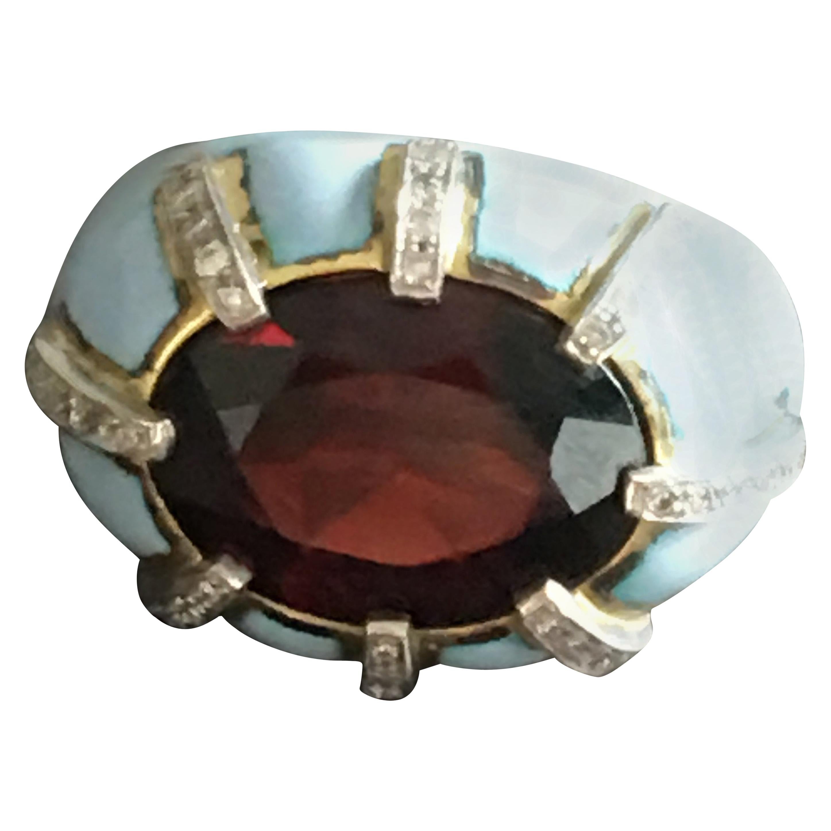 Ring with faced garnet 10ct, baby blu enamel, 18kt White and Yellow gold gr 19,80,  diamonds ct 0,95.
Measure 5 US.
All Giulia Colussi jewelry is new and has never been previously owned or worn. Each item will arrive at your door beautifully gift