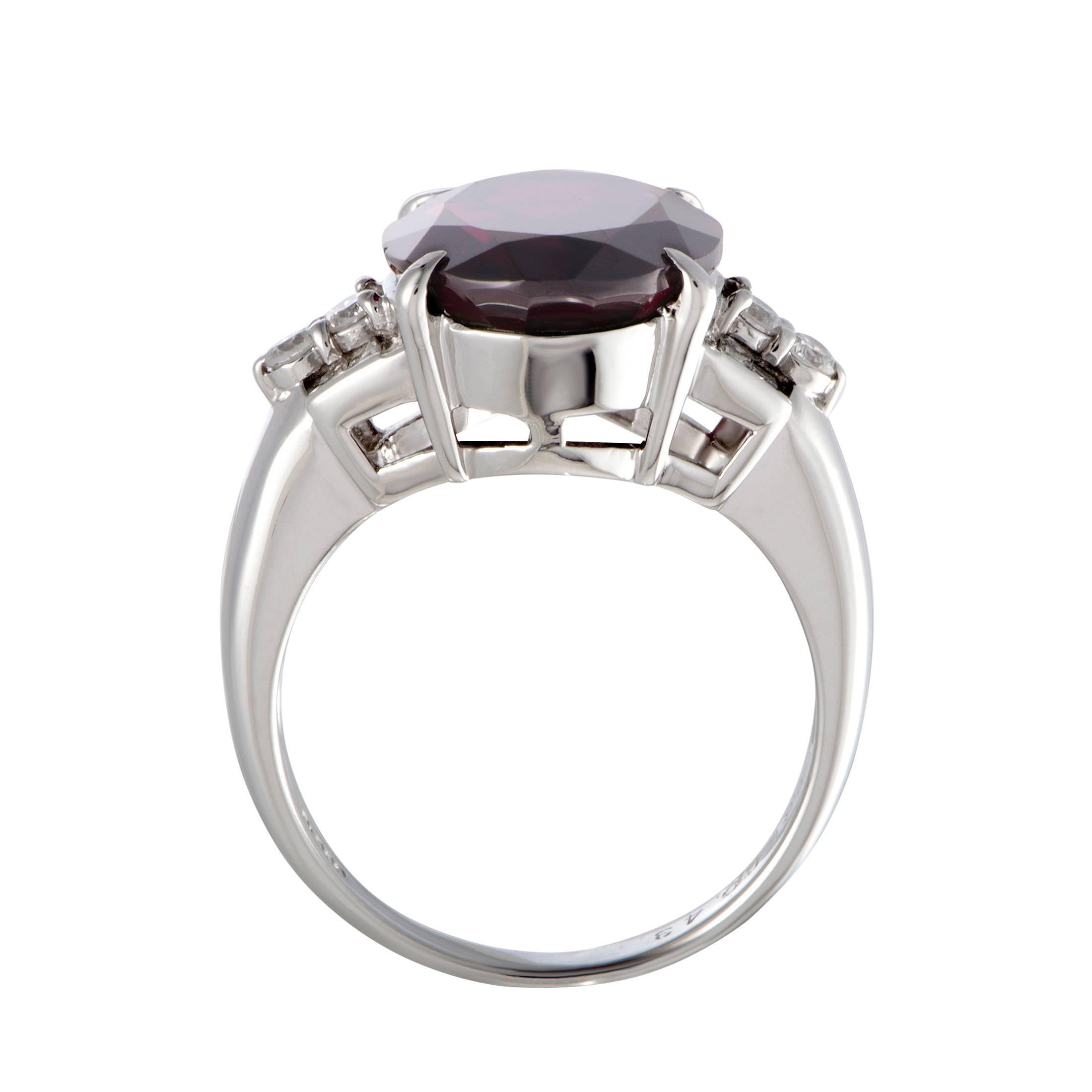 An incredibly bold design is topped off with an imposing garnet in this spectacular platinum ring. The ring is also set with gorgeous diamond stones that amount to 0.43 carats, while the garnet weighs 9.61 carats.
Ring Top Dimensions: 15mm x