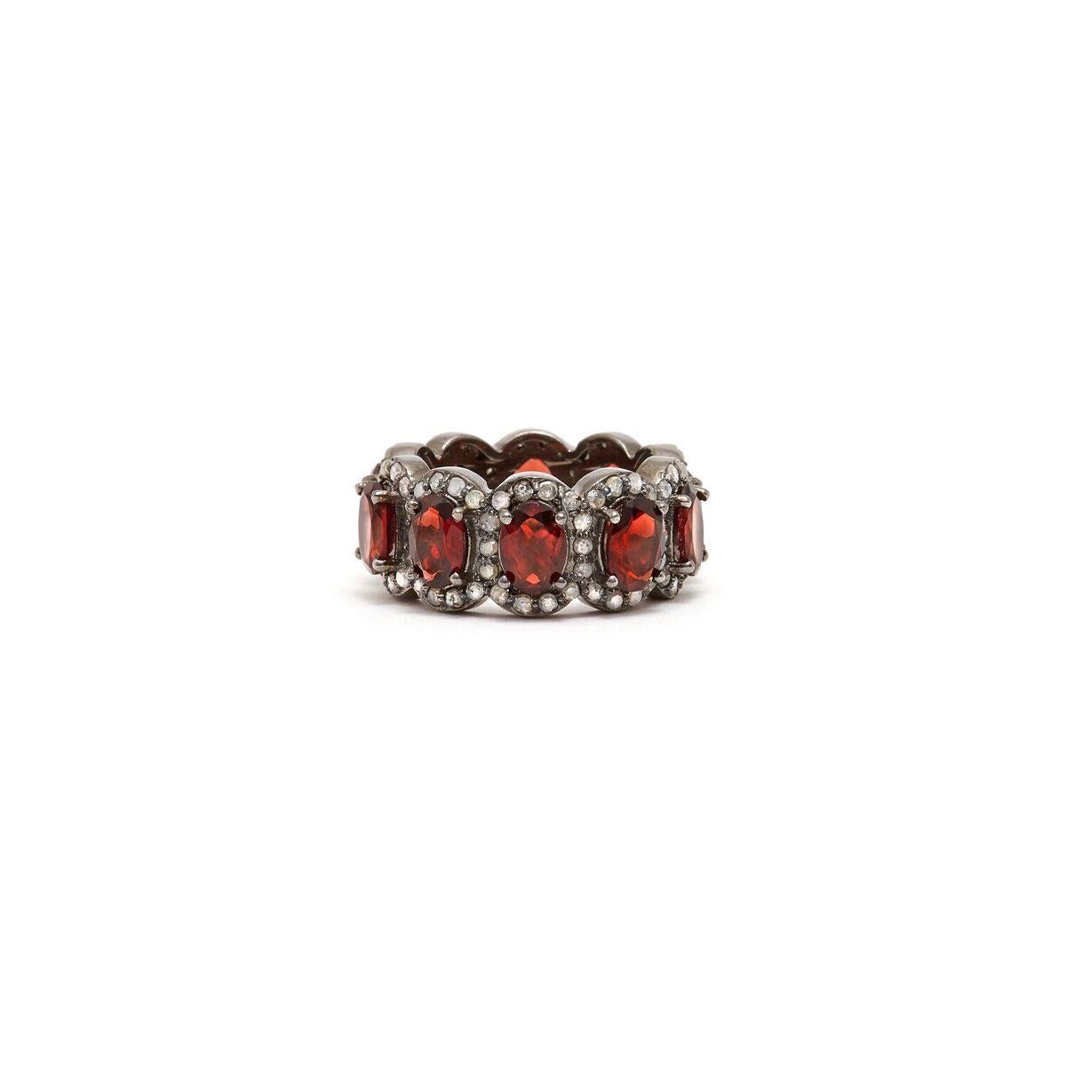 Mesmerizing wine red Garnet baguettes accented with white Diamonds in a blackened silver band reminiscent of an Art Deco Tiara.

- Natural Wine Red Garnet.
- White Diamonds.
- Set in Blackened Oxidized Silver.