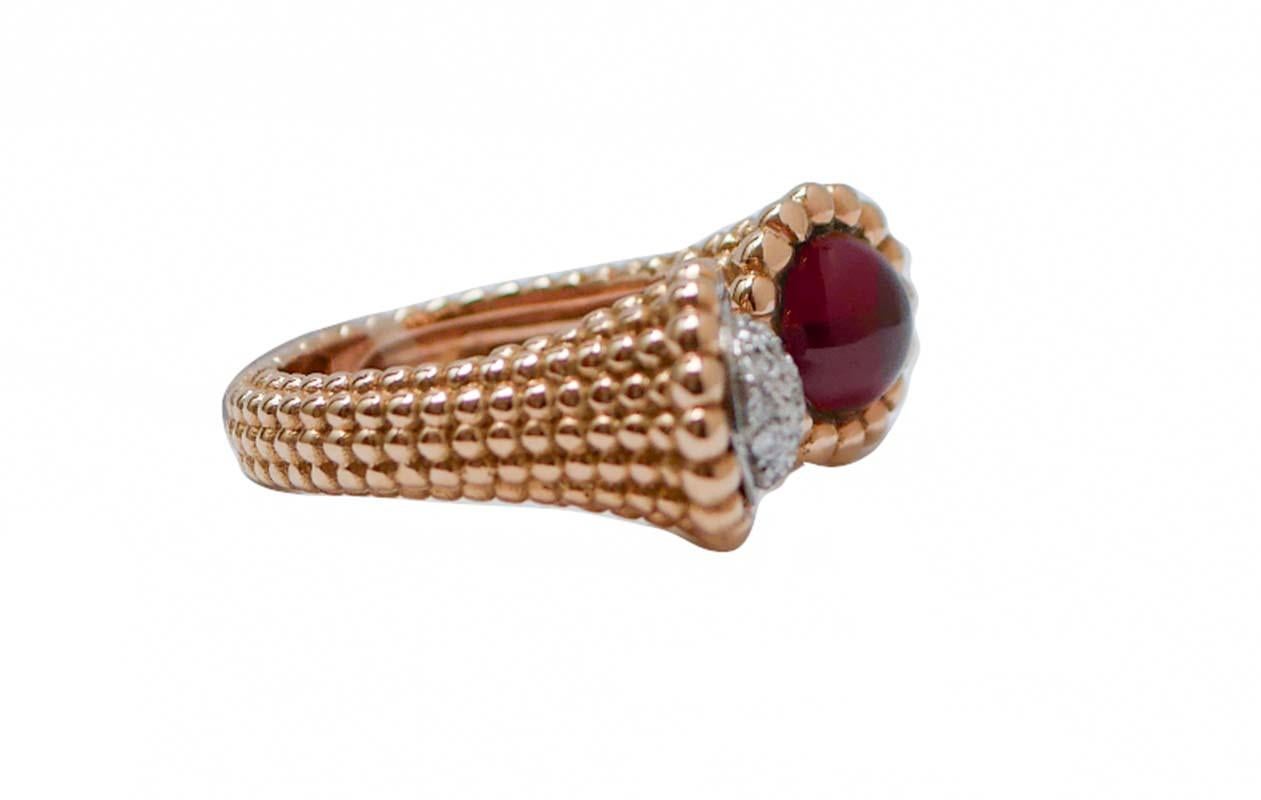 Elegant ring in 18 kt rose gold structure mounted with a structure in white gold studded with diamonds and a garnet.
Diamonds 0.35 ct
Garnet 2.10 ct
Total Weight 14.70 gr 
RF   +HCHO
Italian Size 14
Usa Size 6.84
French Size 54

For any