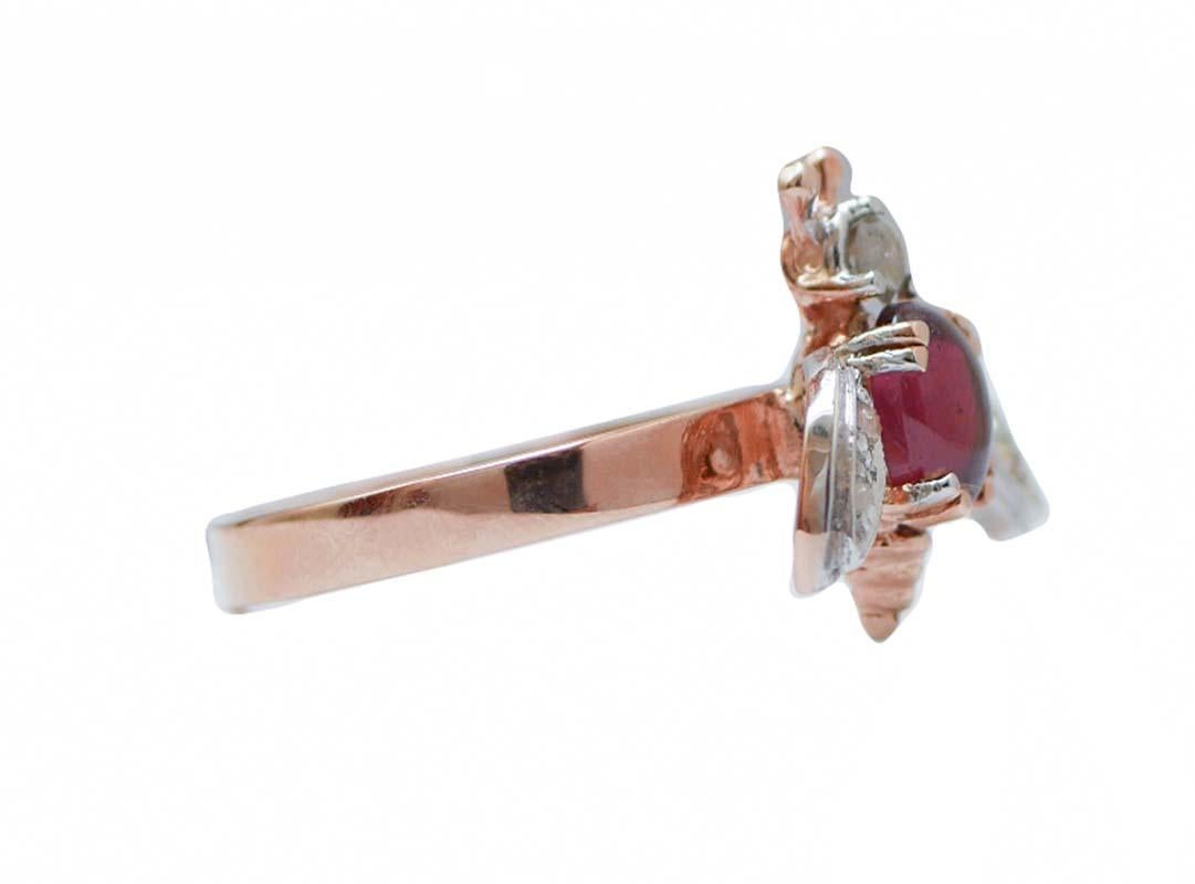 Particular fly shape ring in 9 karat rose gold and silver structure mounted with a diamond as head, a garnet  as body and wings studded with diamonds.
This ring was totally handmade by Italian master goldsmiths and it is in perfect