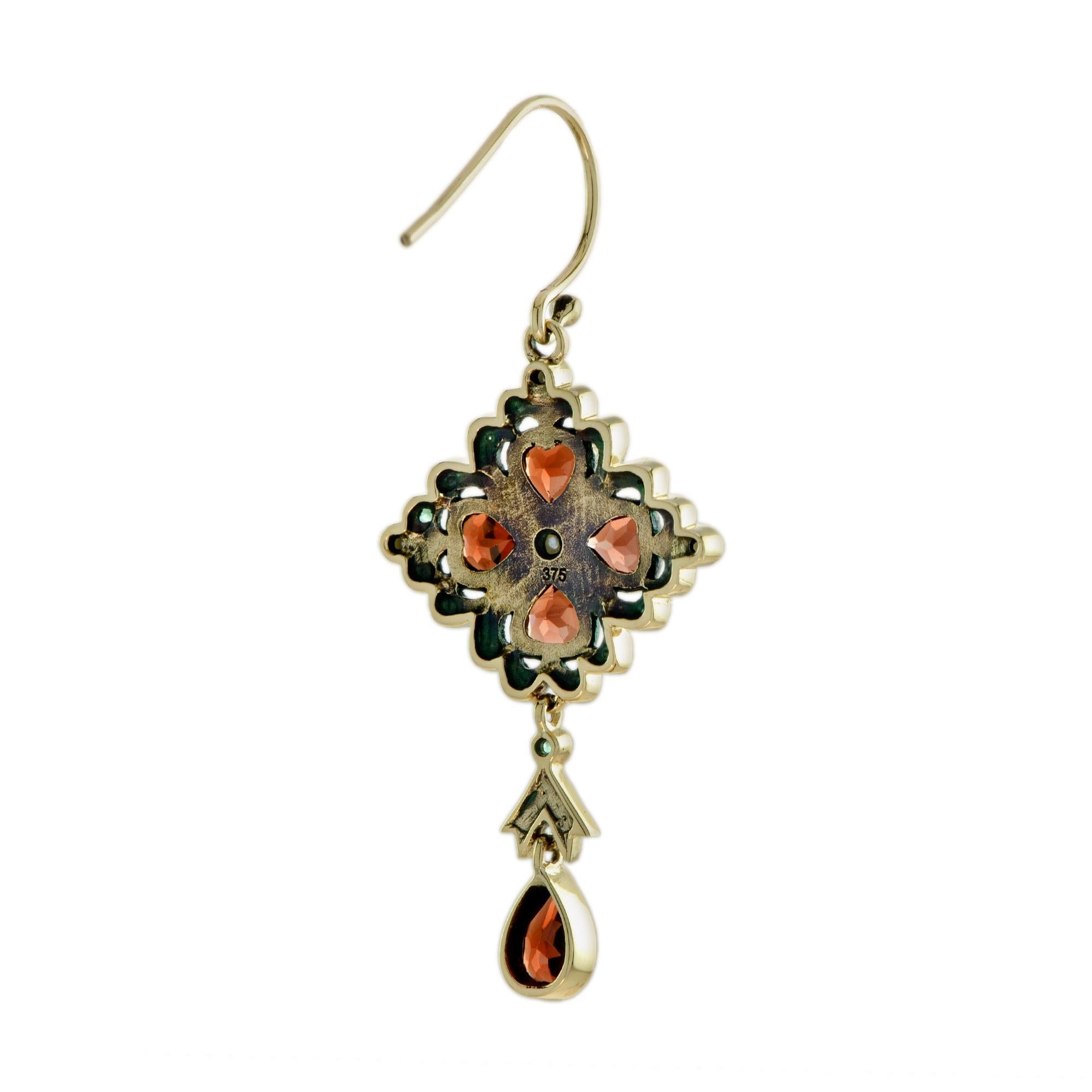 This dangle earrings are all you need on your spring day! Made in 9k yellow gold, the top part of these earrings are peal, garnet and emerald. The fusion of the yellow gold with the green and red shades of the stones makes these earrings exquisitely