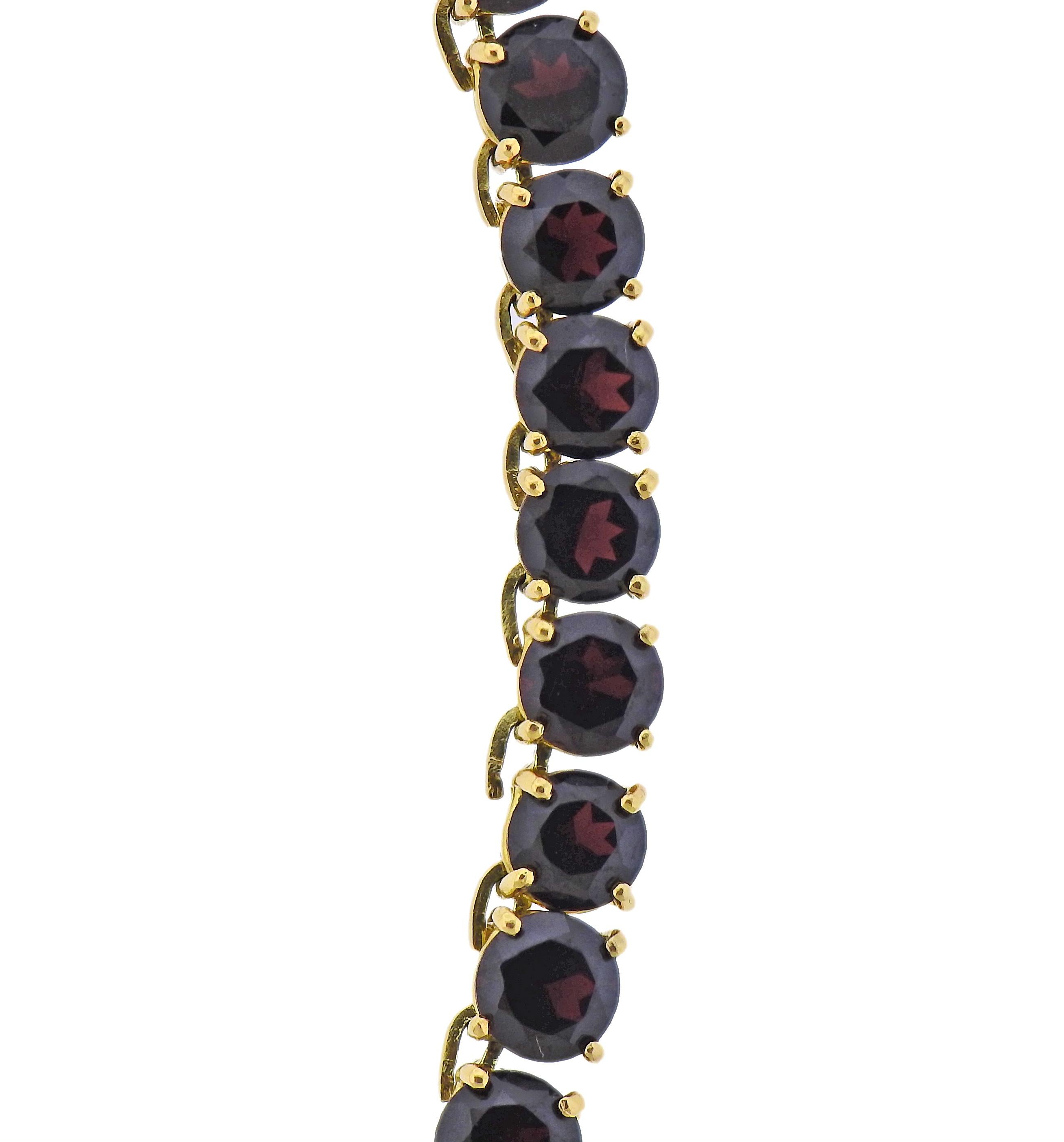 18k gold riviera necklace with garnets, measuring from 6mm to 6.2mm. Necklace is 16.5