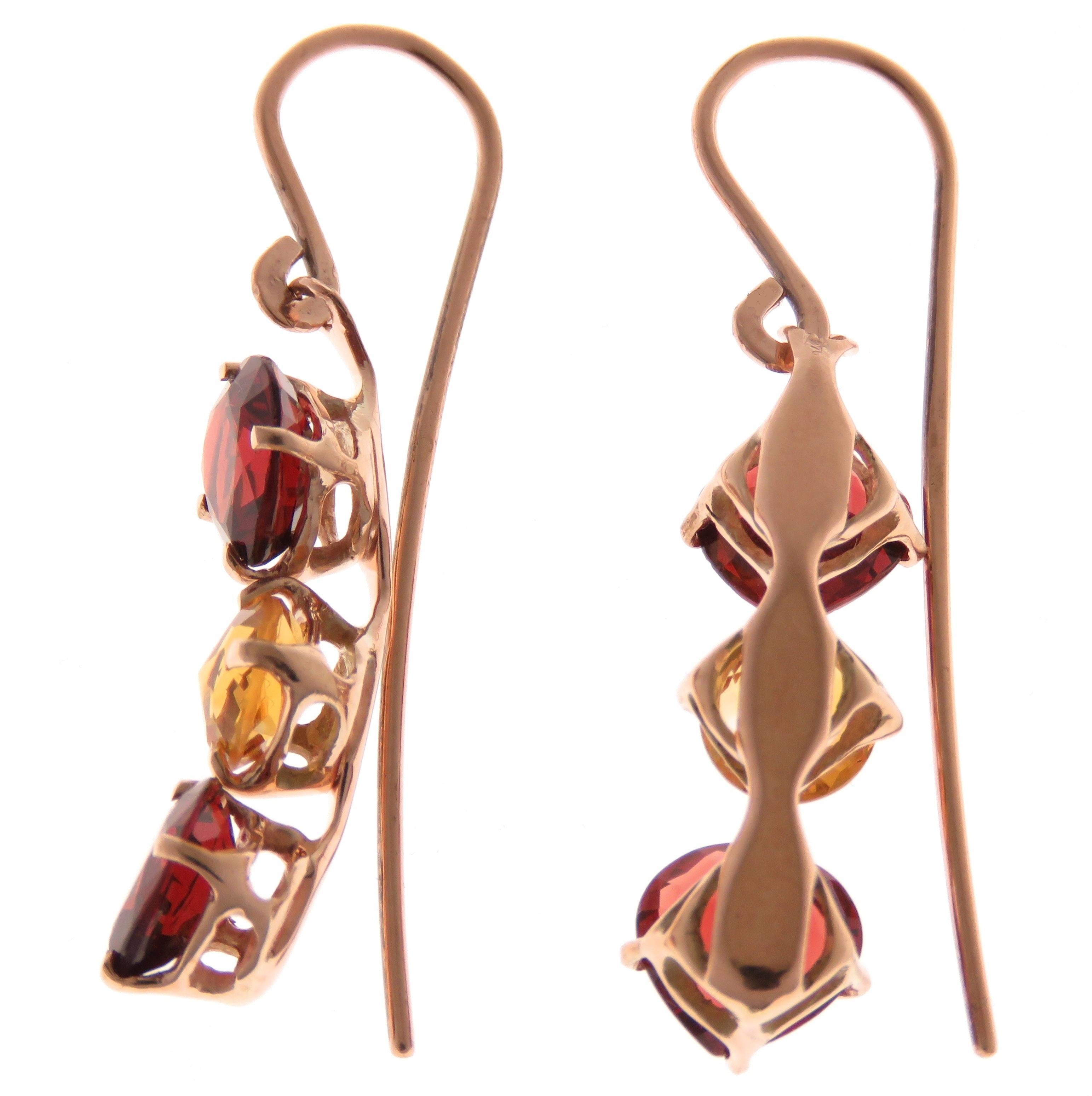 Elegant earrings in 9 karat rose gold handcrafted in Italy by Botta Gioielli with 4 natural heart cut garnets and 2 natural rose cut citrines. Each earring is marked with the Italian Gold Mark 375 and Botta Gioielli Brandmark 716MI.

4 natural