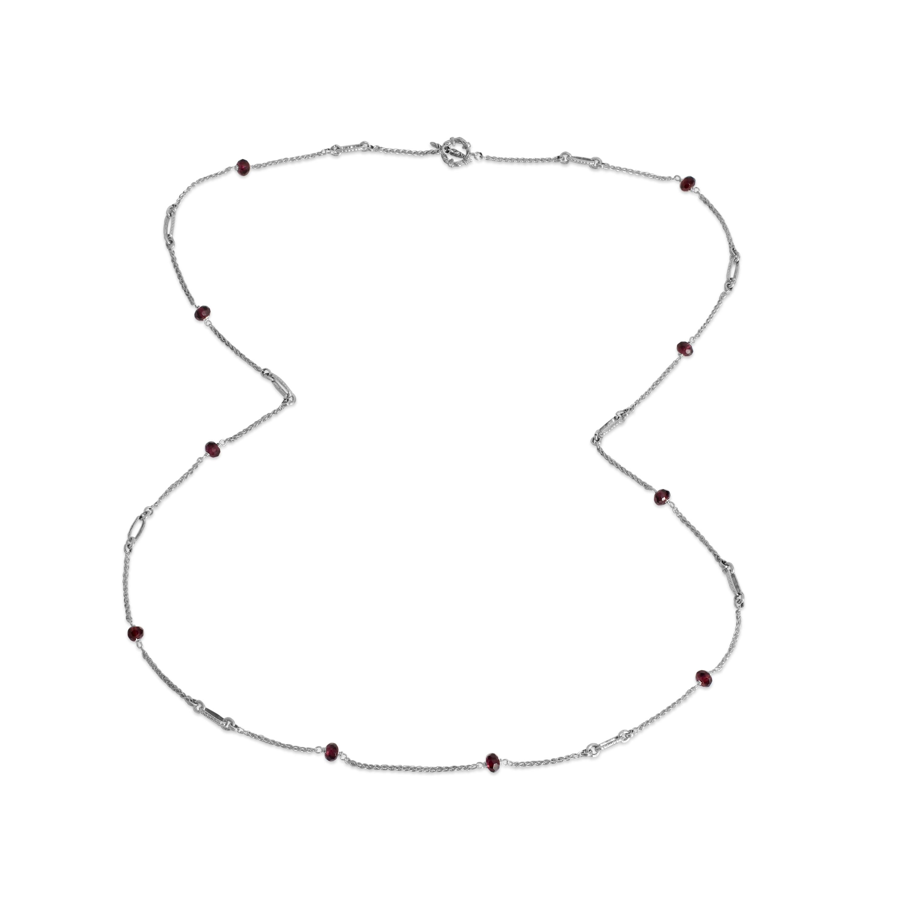Indulge in the rich allure of this Garnet Link Chain Necklace, a stunning addition to any jewelry collection. Crafted with precision in sterling silver, each link of the chain showcases the deep red hue of garnet stones, renowned for their vibrant