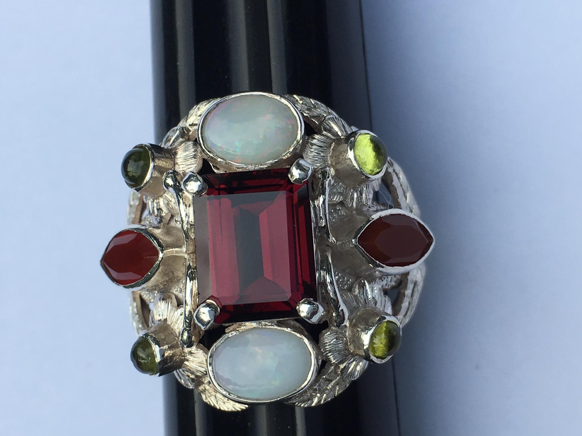 Garnet, Opal, Carnelian and Peridot Cocktail Ring This item is on sale for Black In New Condition In Trumbull, CT