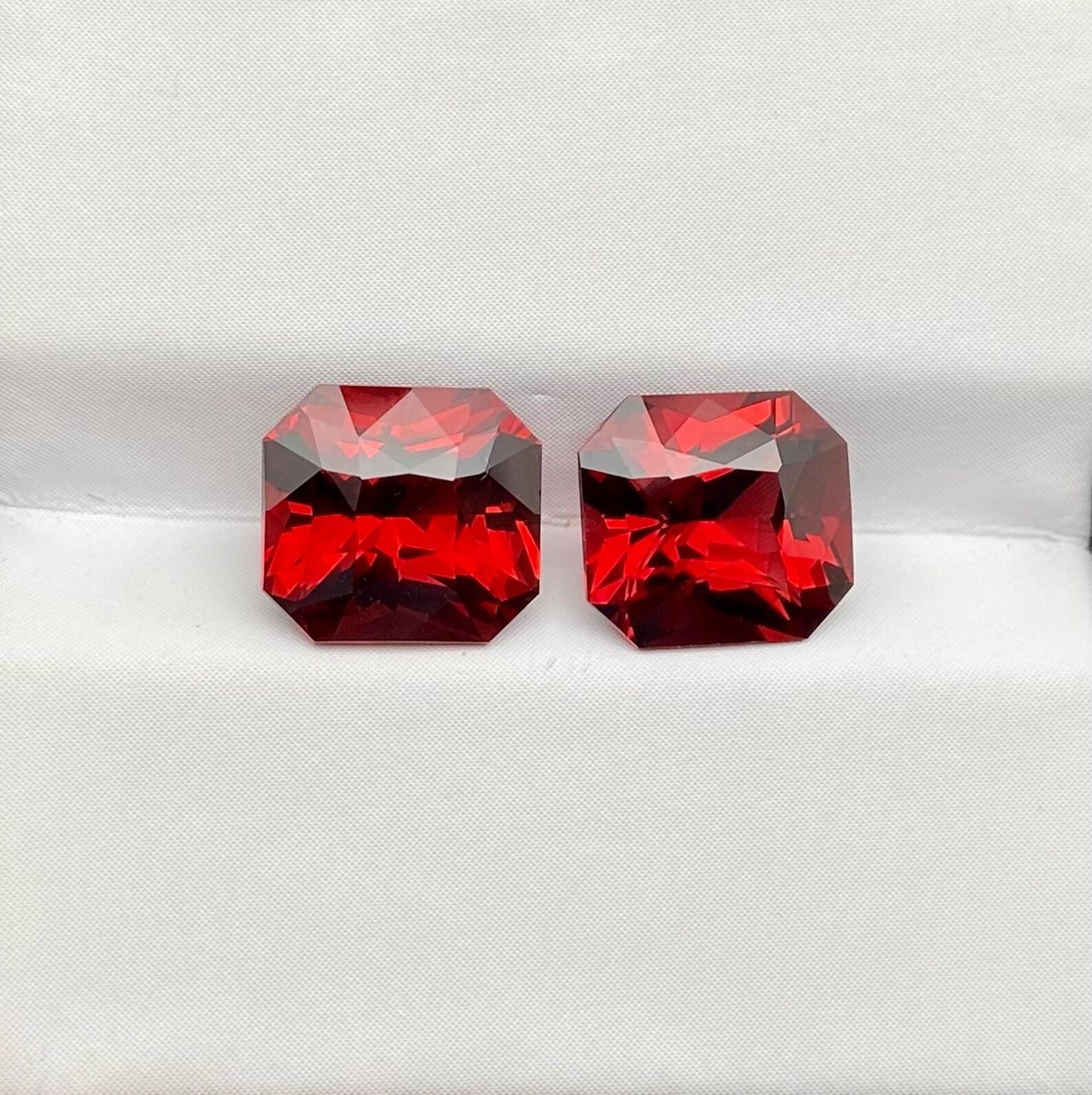 Natural Garnet Rhodolite gemstone Pair

Laboratory certified GFCO
Gemstone Color: Vivid Red-Orange/Orange-Red
Gemstone Type: Garnet Rhodolite
Gemstone size: 8.41x7.67x5.37mm., and 8.42x7.60x5.16 mm
Cut Grade: Excellent
Clarity/Grade: Loupe