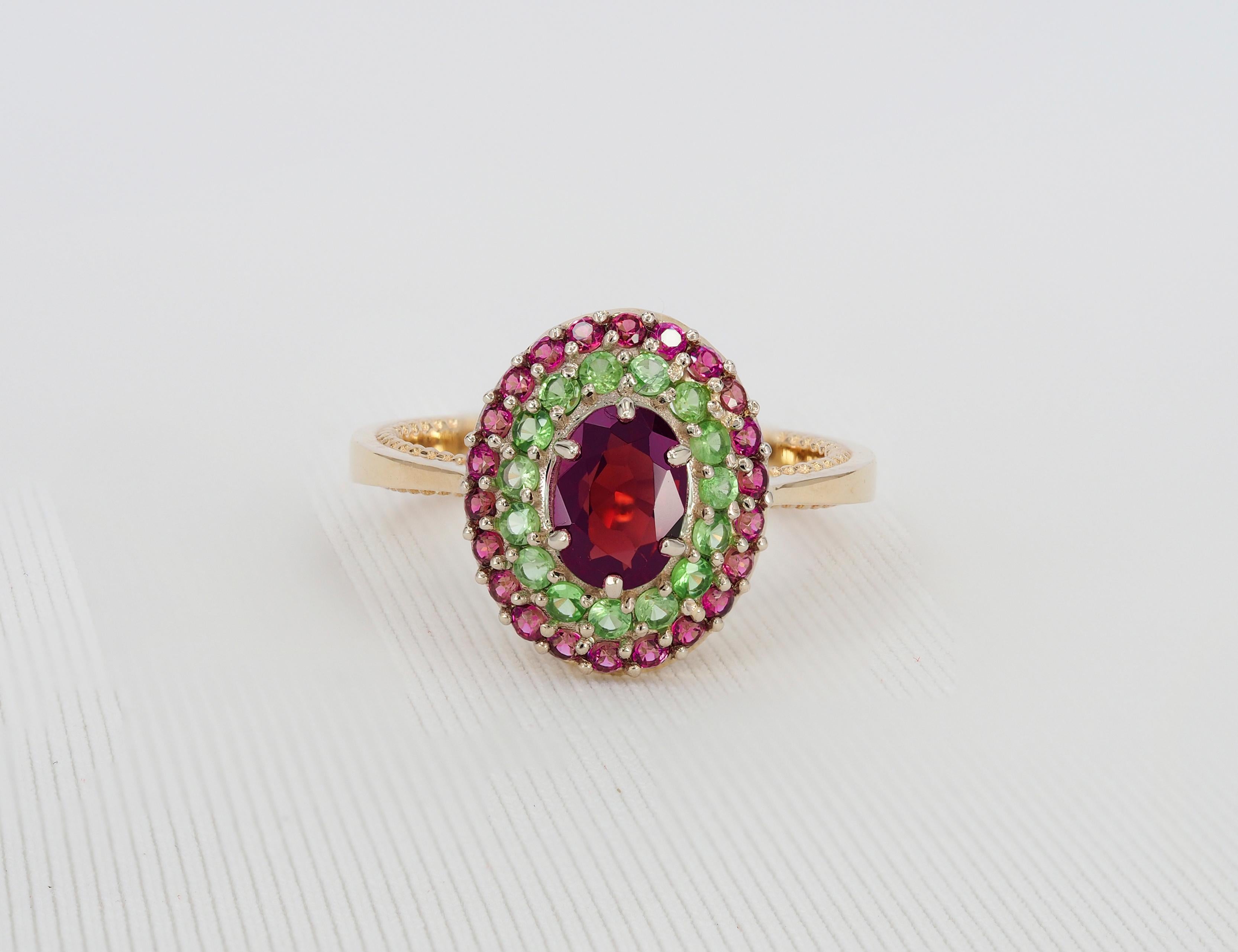 Garnet ring with side tsavorites and rubies.

Metal: 14k gold
Weight - 3.90 gr. depends from size

Central stone:
Garnet - 1.22 ct
Measurements - 7.40 x 5.03 x 3.97 mm
Color- Dark Purple
Transparency -Transparent

Side stones:
Tsavorites - round