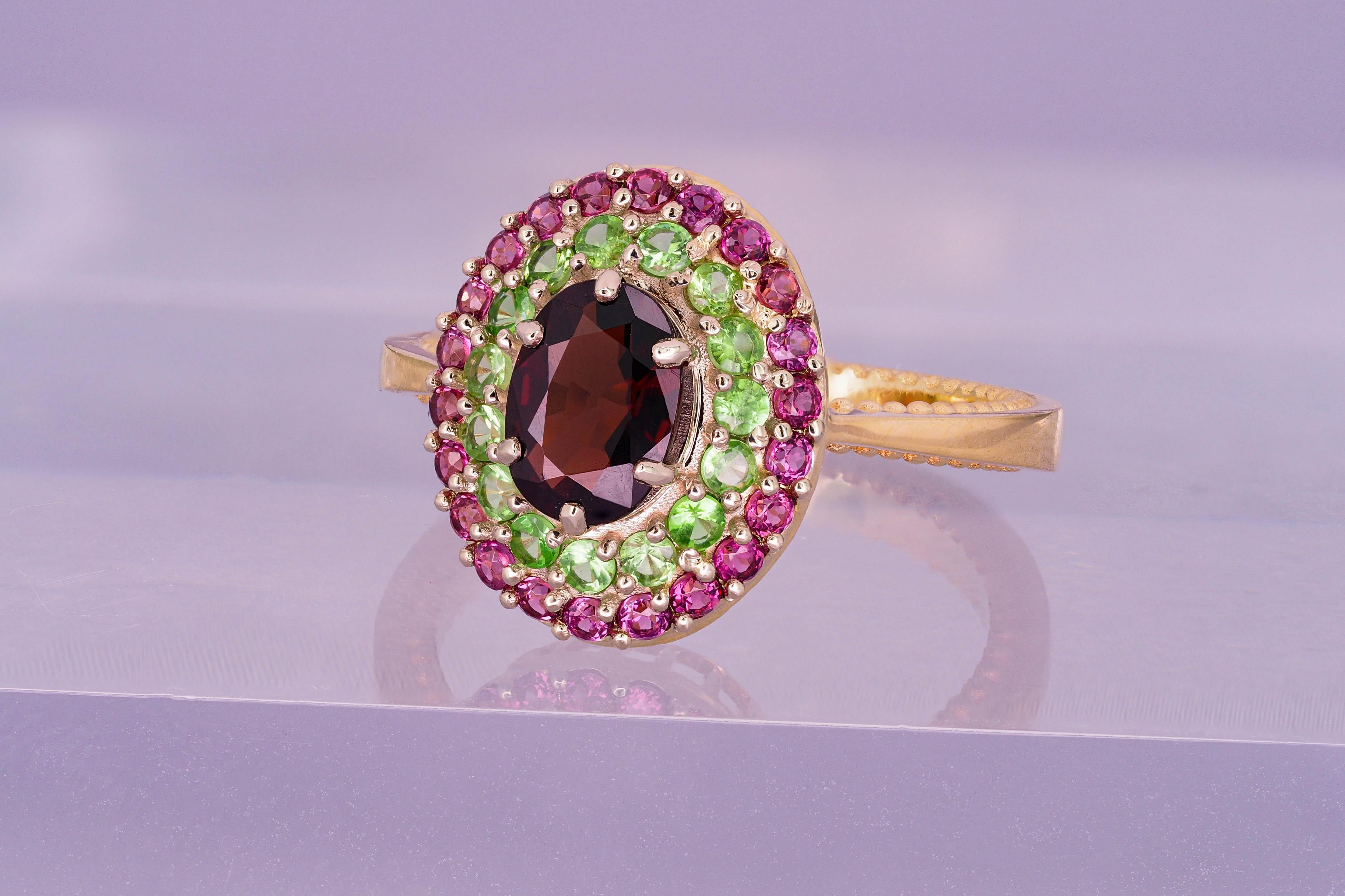 Women's Garnet ring with side tsavorites and rubies. For Sale