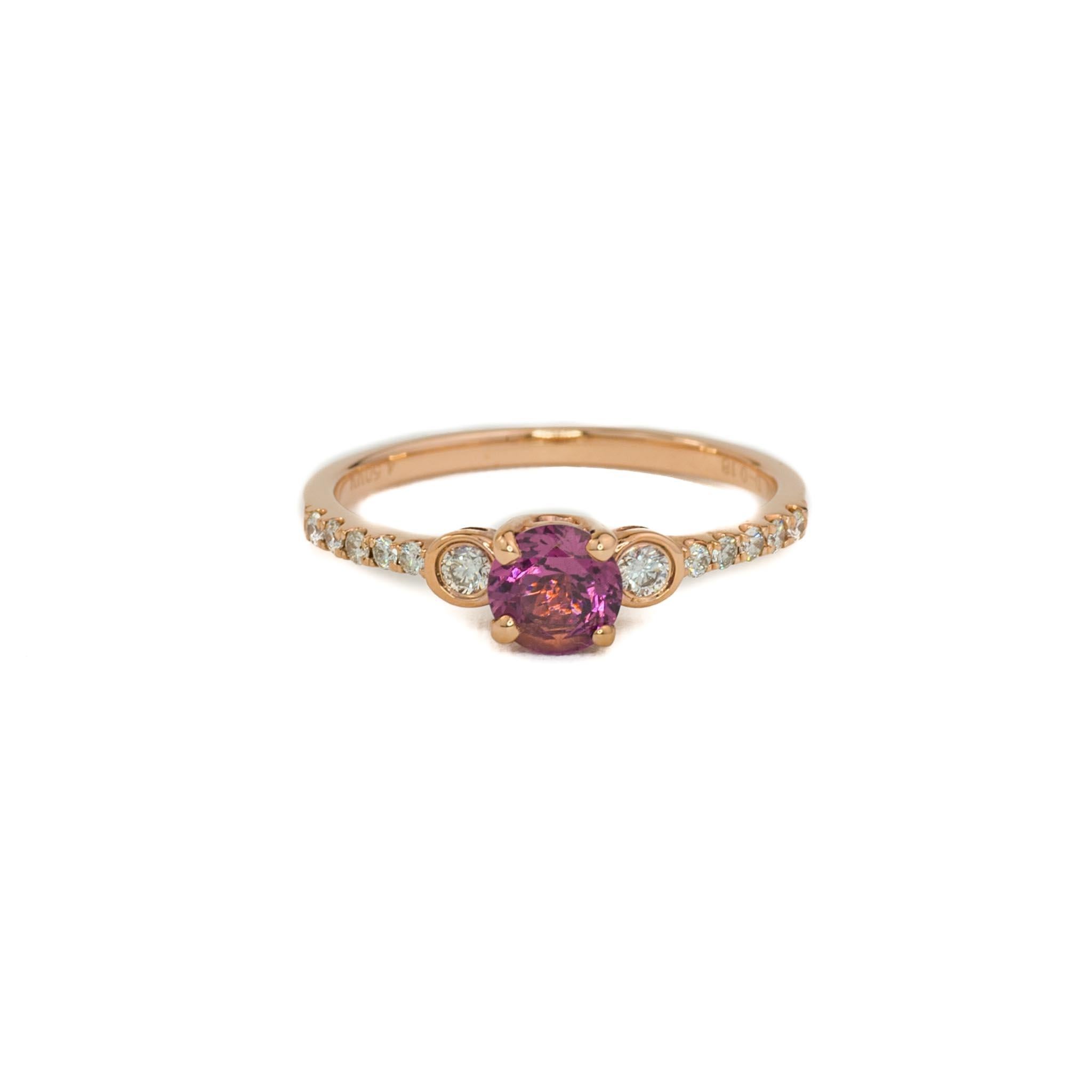 Treat yourself to the perfect ring for your January birthday with this stunning bezel set diamonds and rhodolite garnet ring. Crafted from 14K rose gold, the conflict free diamonds radiate elegance and sophistication. The center stone is a vibrant