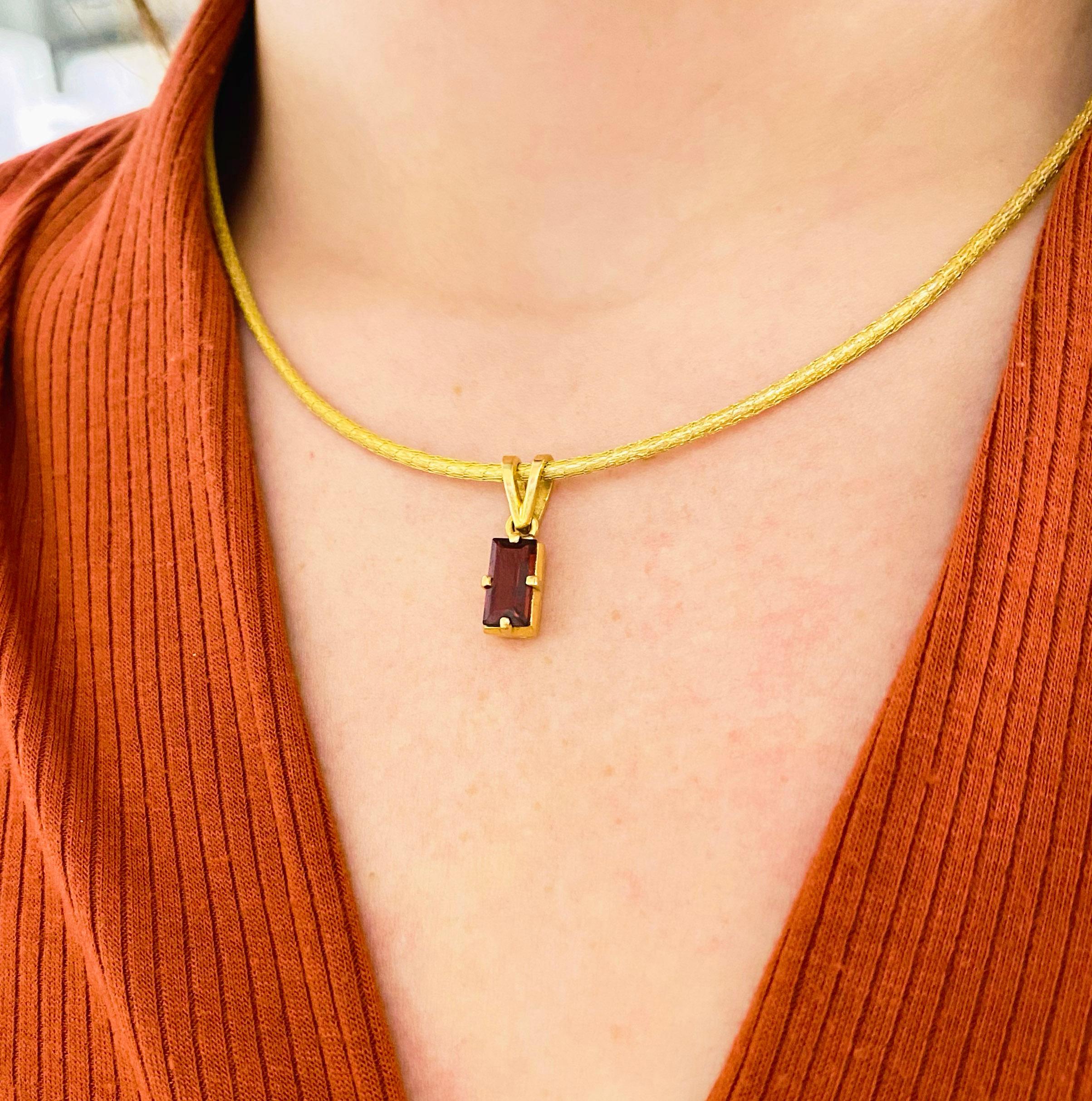 This stunningly beautiful Brazilian genuine garnet is set in polished 18k yellow gold draped on a gorgeous gold silk chain provides a look that is very modern yet classic! This necklace is very fashionable and can add a touch of style to any outfit,