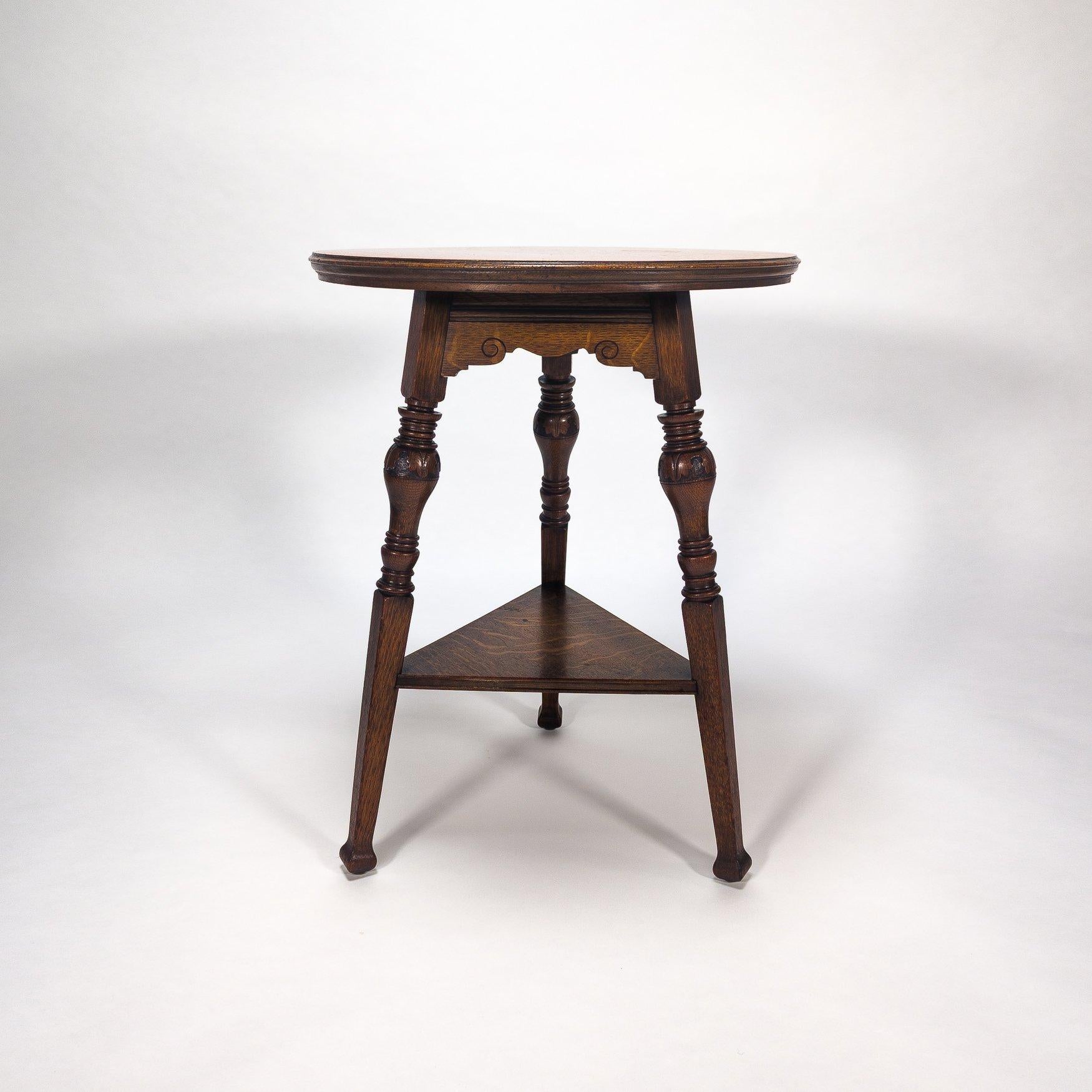 Garnet & Sons of Warrington
A good quality Aesthetic Movement oak side or cricket table with a circular quarter sawn top gives wonderful figuring to the grain, with a shaped and scroll-carved apron below. Three legs with bulbous carved decoration to