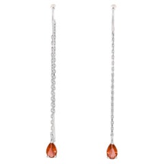 Boucles d'oreilles grenat en or 14k.