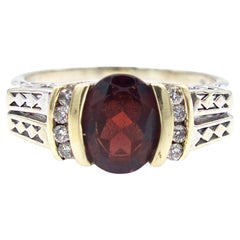 Anello con granato bicolore