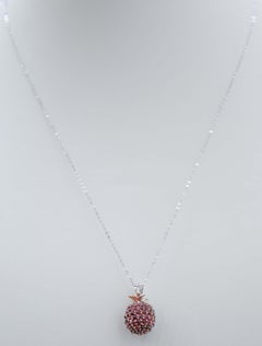 Garnets, Diamonds, 14 Karat White Gold and Rose Gold Pendant Necklace.