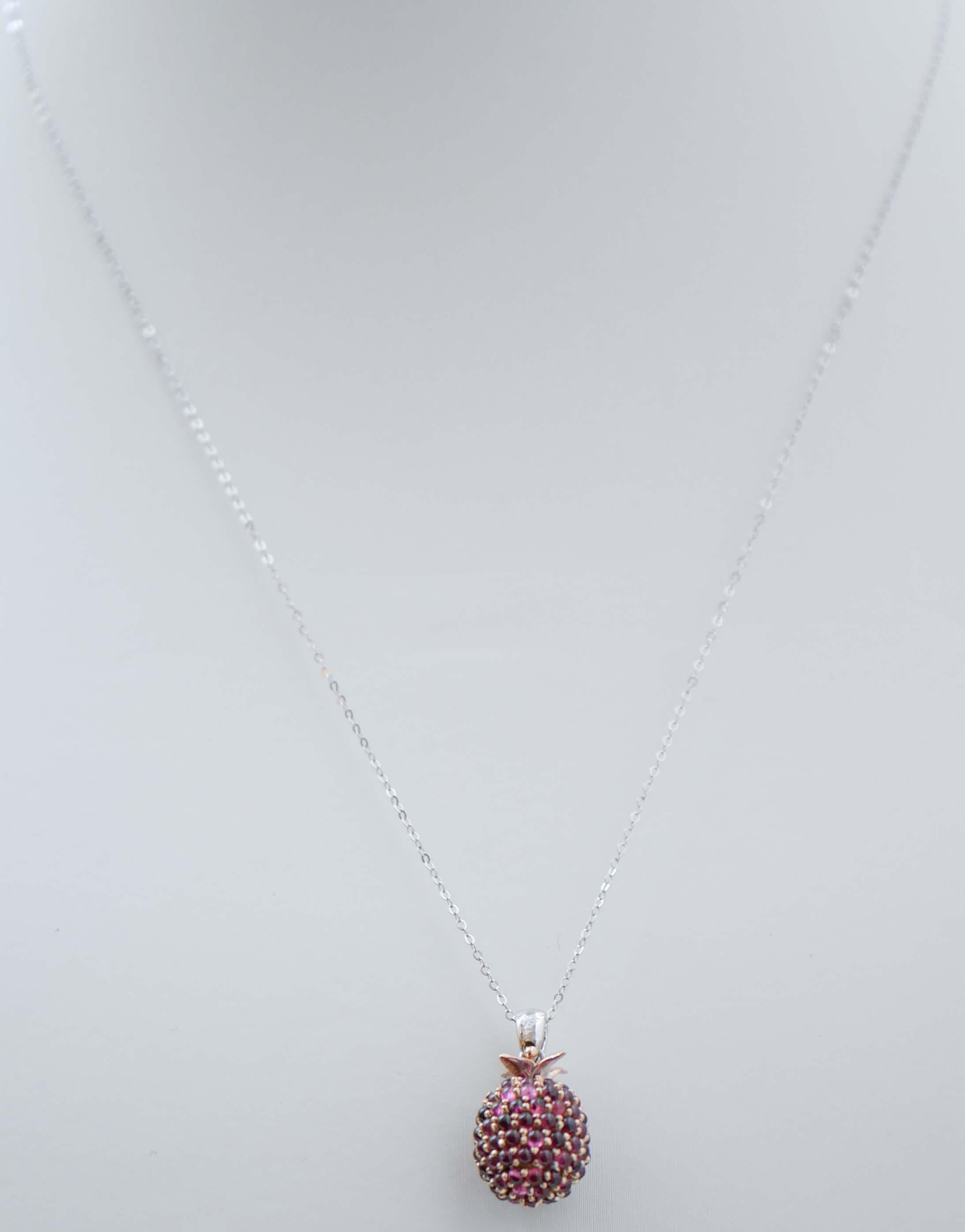 Mixed Cut Garnets, Diamonds, 14 Karat White Gold and Rose Gold Pendant Necklace. For Sale