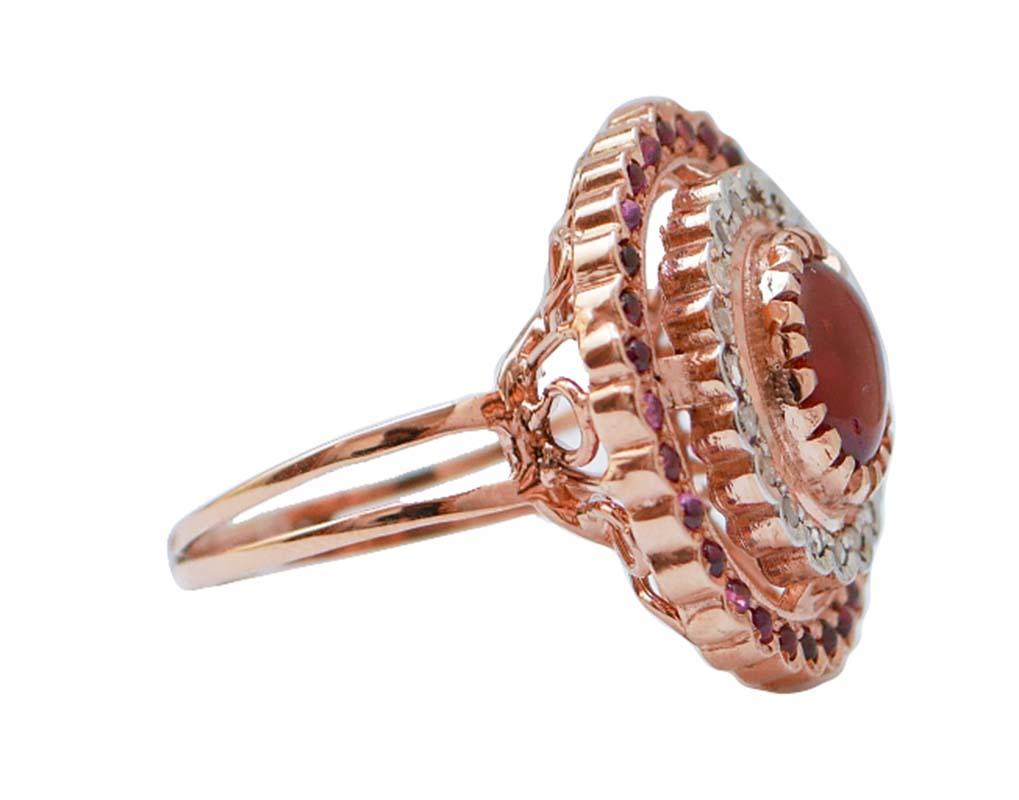 Amazing ring in 9 kt rose gold and silver structure mounted with a central garnet surrounded by a frame of garnets and diamonds.
This ring was totally handmade by Italian master goldsmiths and it is in perfect conditions.
Diamonds 0.19 ct
Garnets