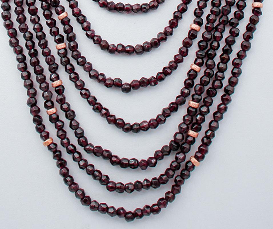 Beautiful multi-strands necklace ten rows of garnets alternated with silver structure and a silver clasp in rose gold color.
This necklace was totally handmade by Italian master goldsmiths and it is in perfect conditions.
Garnets 1812.50 ct
Total