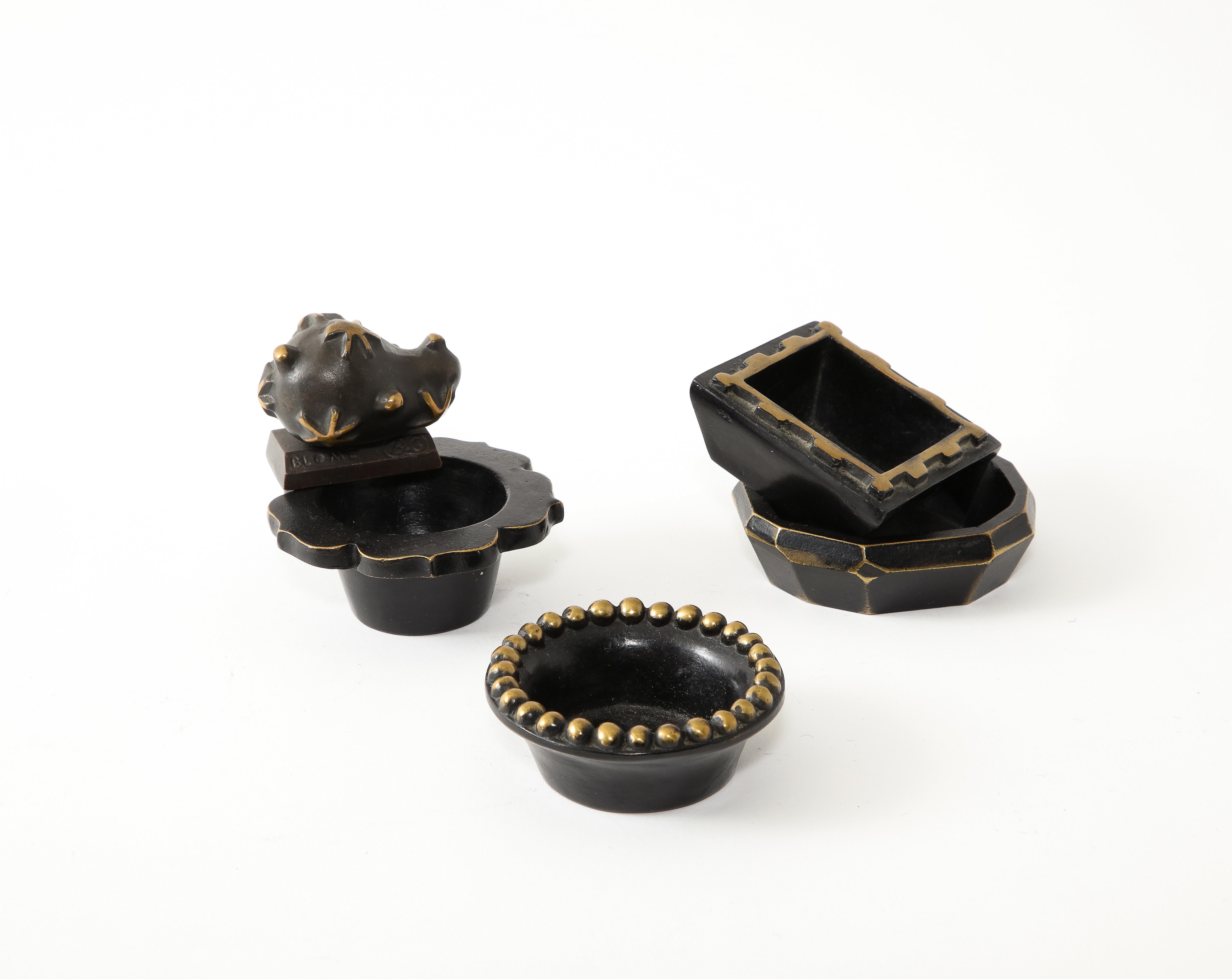 Cast bronze set of objects designed in the 1990s by
French artists Elisabeth Garouste et Mattia
Bonetti for Herbert Blome signed B.G. BLOME
B.G.H. EDITIONS/BLOME.
A set was sold by Wright20 auctions for $7500.
size is 3x3x1 on average.