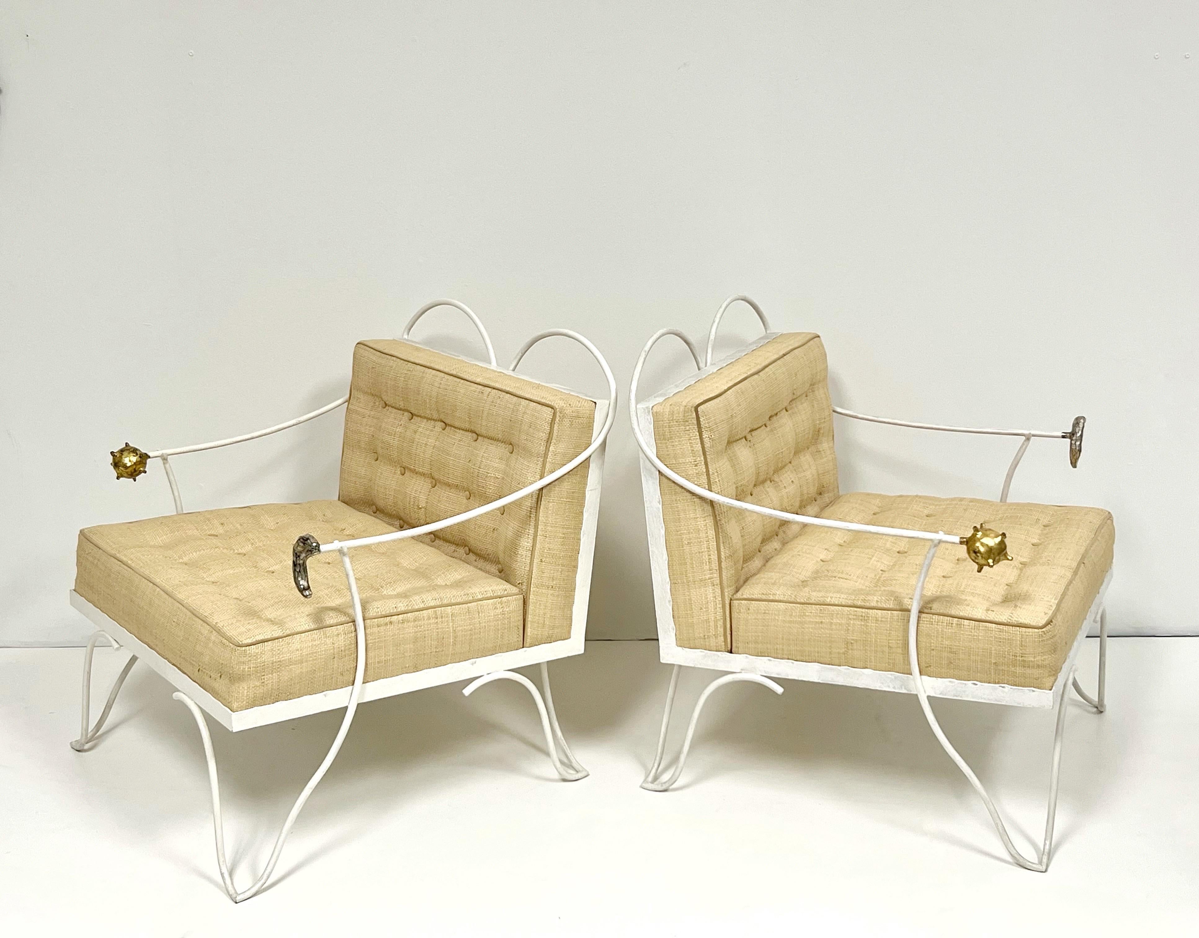 A pair of Garouste and Bonetti chairs and ottoman. Steel frames with hand applied enamel finish. A stylized representation of the sun and the moon at the end of the arms done in gold and silver leaf respectively. Retain the original hand woven