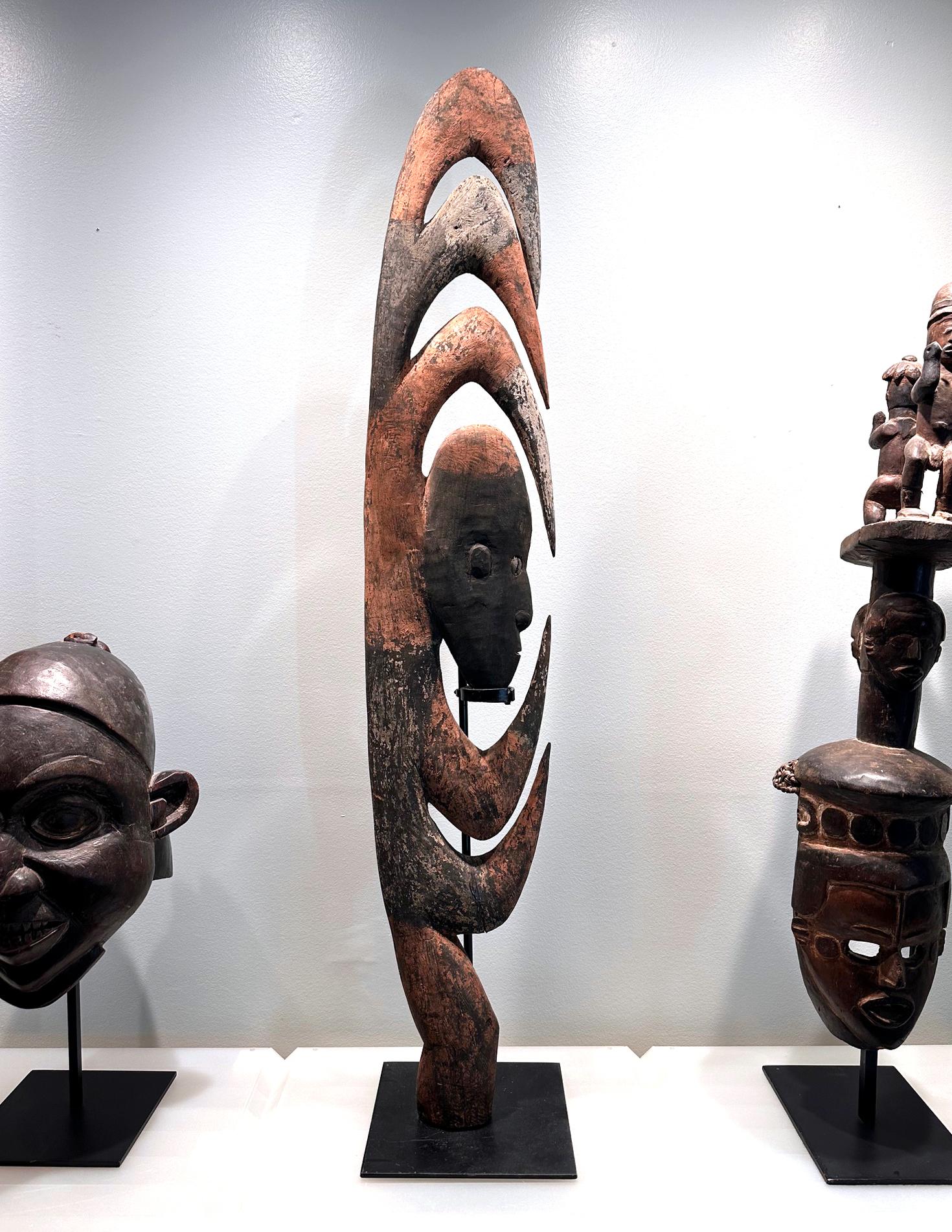A Garra hook by Bahinemo People of Hustein Mountains from Mid-Sepik River region in Papua New Guinea. The highly sculptural mask is one of the most iconic and mysterious designs from PNG that often stirs the viewer's imagination. This hood figure