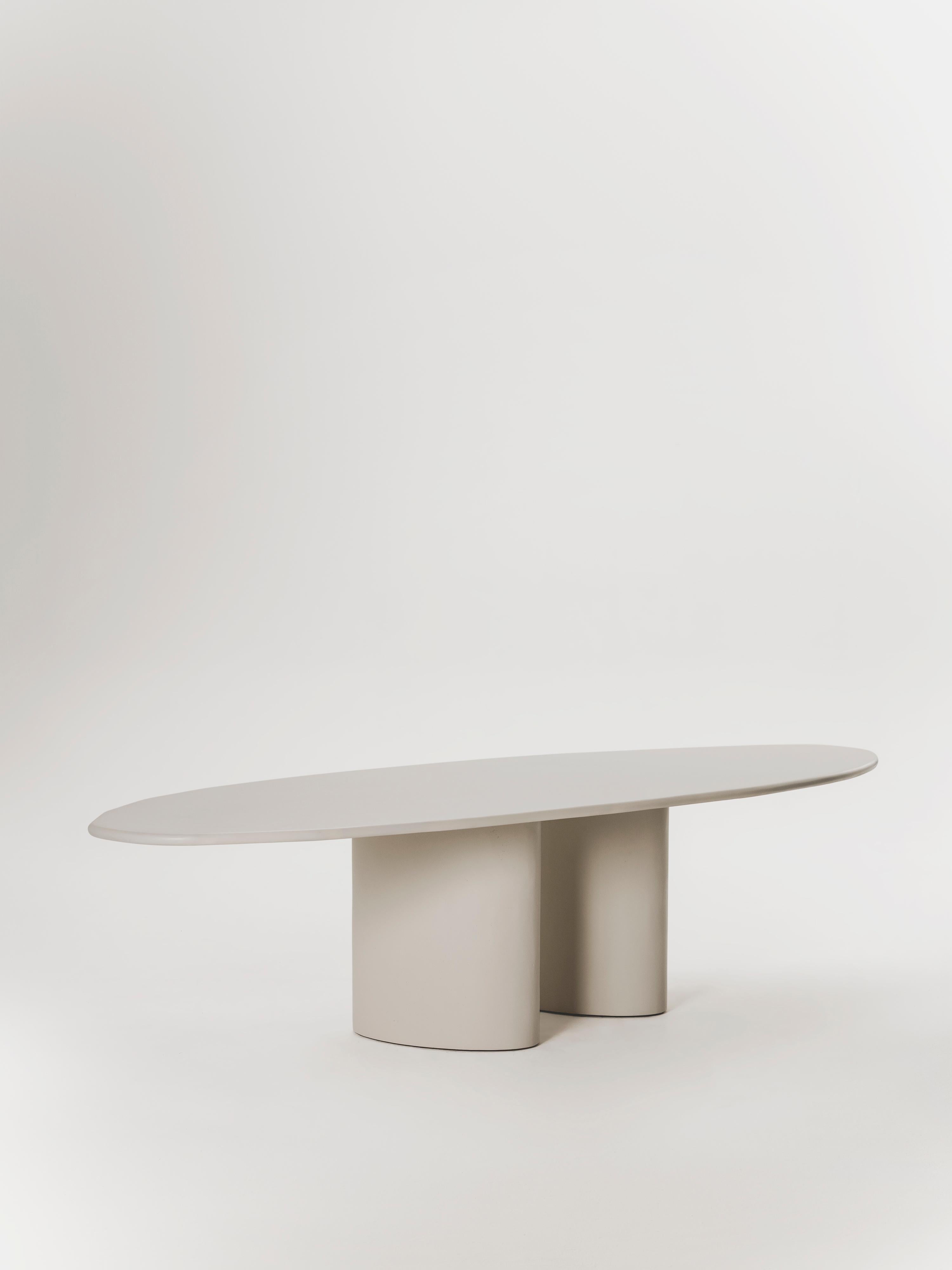 Handcrafted in Spain by expert artisans, this oval-shaped dining table from Marlot Baus combines timeless design with modern craftsmanship. Each piece is carefully made using our signature microcement technique, layered by hand to achieve a smooth,
